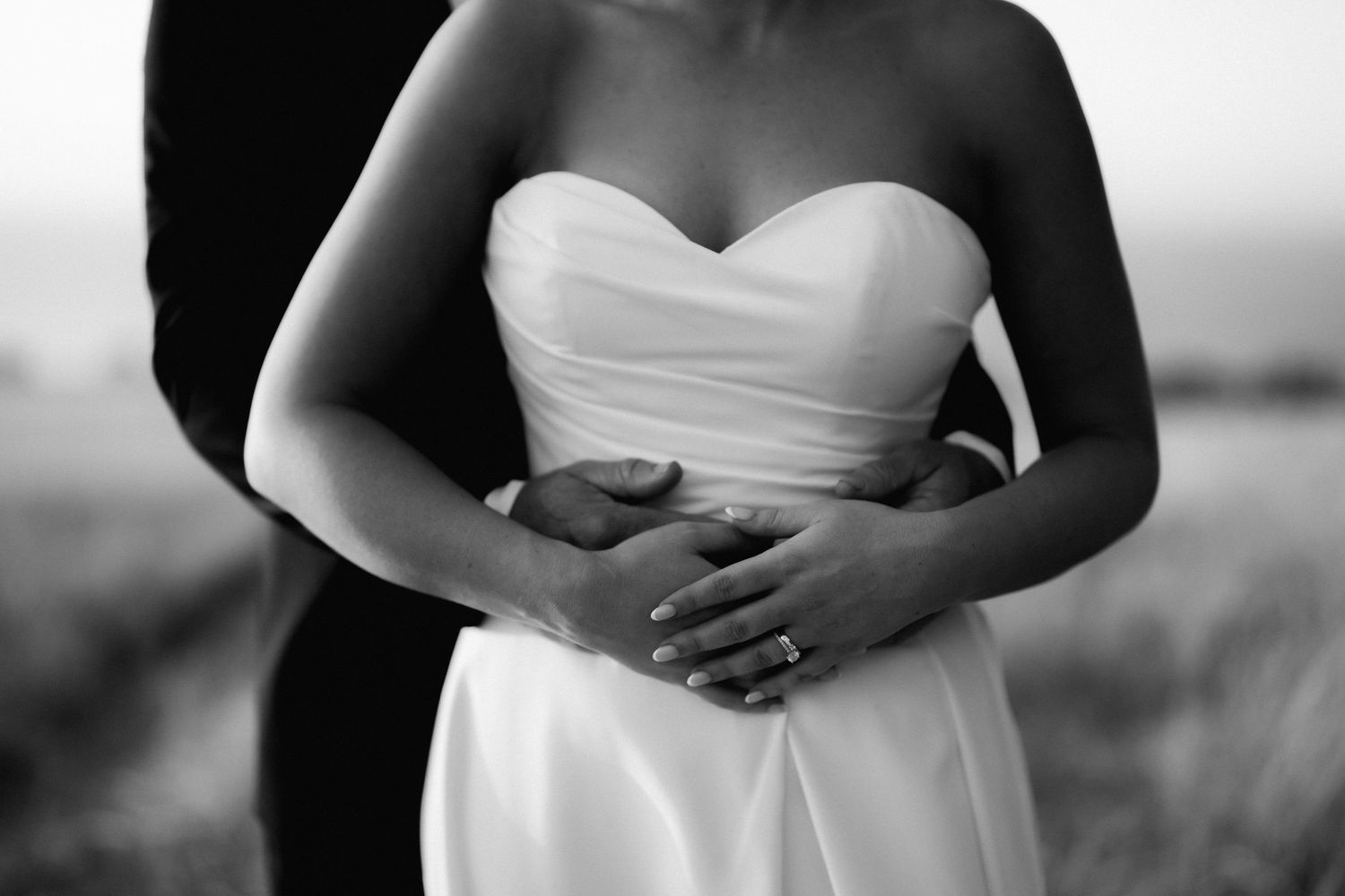 Close up detail of a sweetheart neckline wedding dress in black and white.