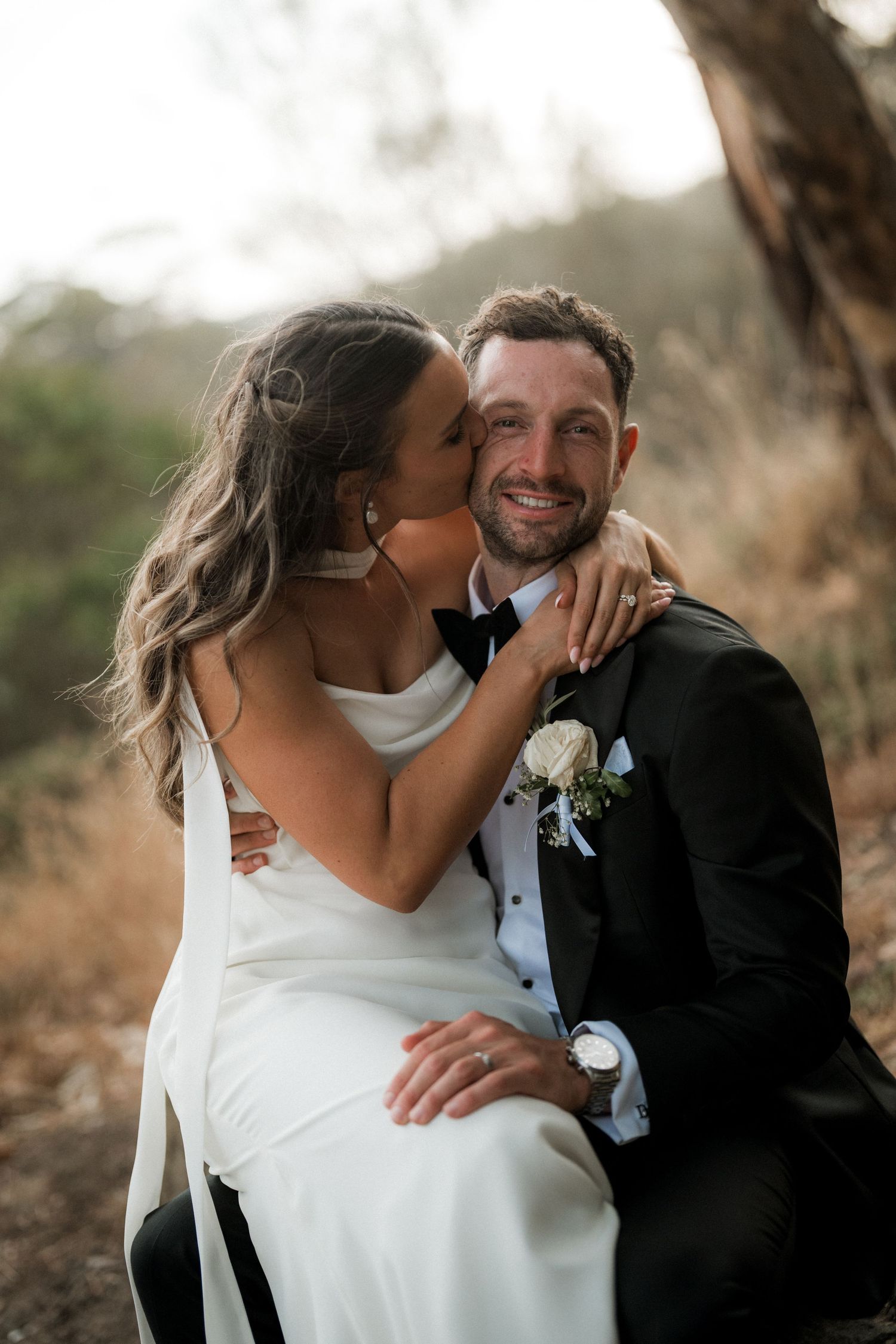 A romantic wedding photo series showing tender moments between a couple in formal attire outdoors.