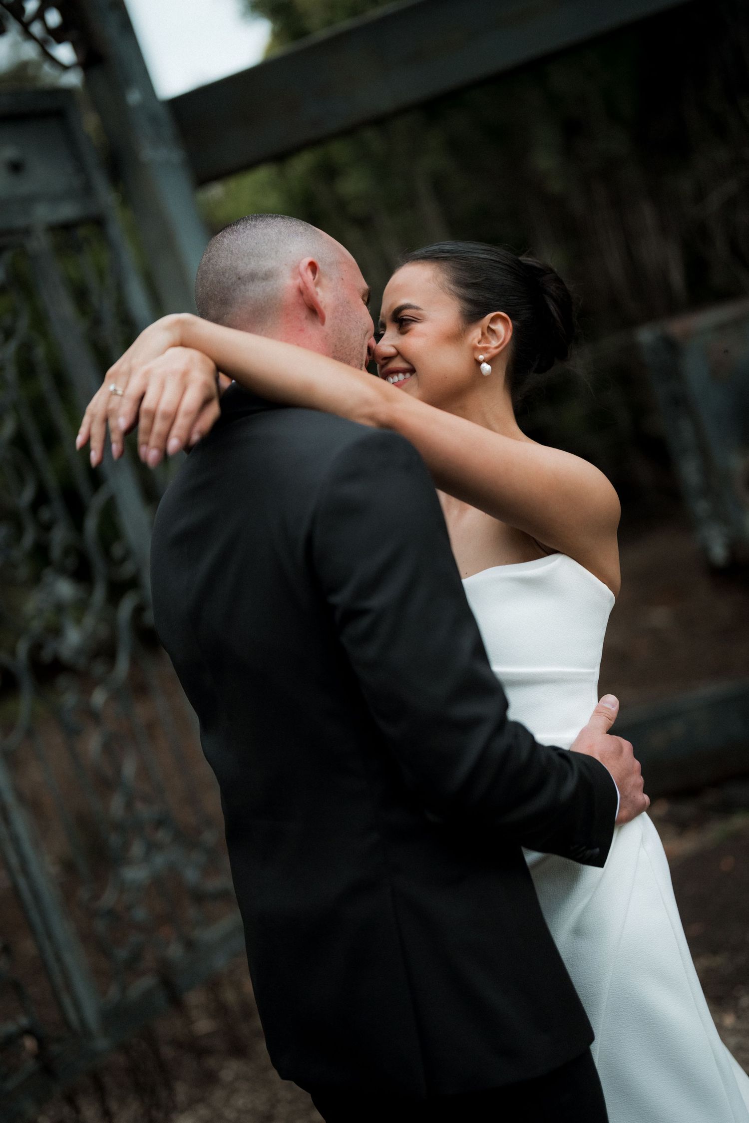 Sequence of romantic dance poses between newlyweds in formal wedding attire.