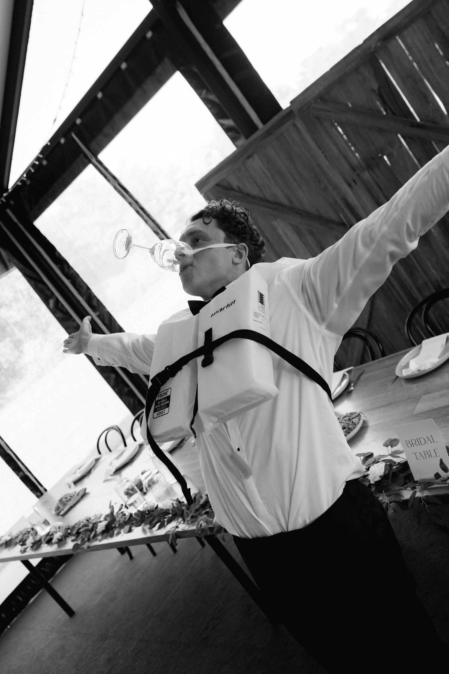 Black and white photos of chefs working in a professional kitchen from dramatic angles.