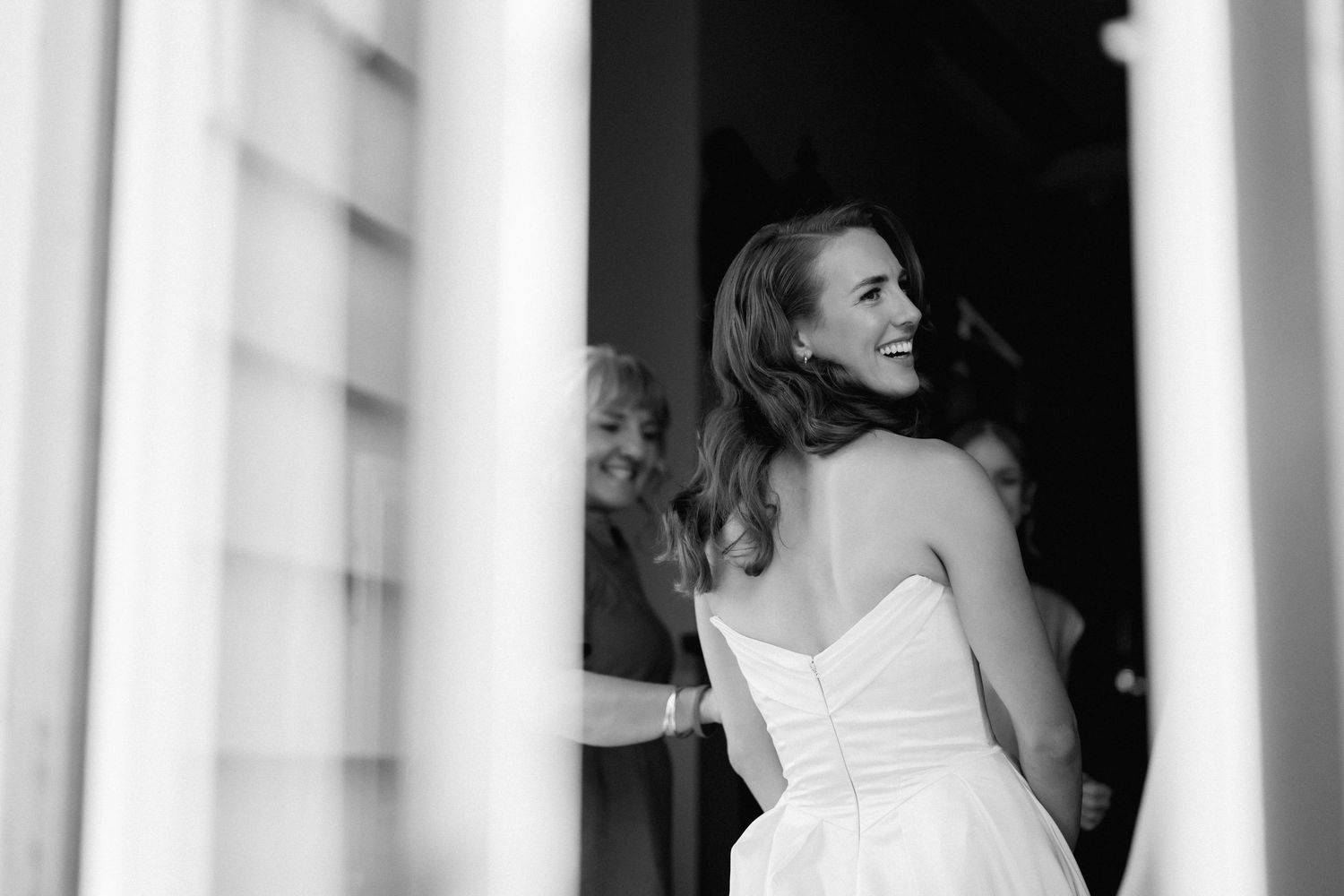 Wedding venue interior with classic white columns and elegant architectural details.