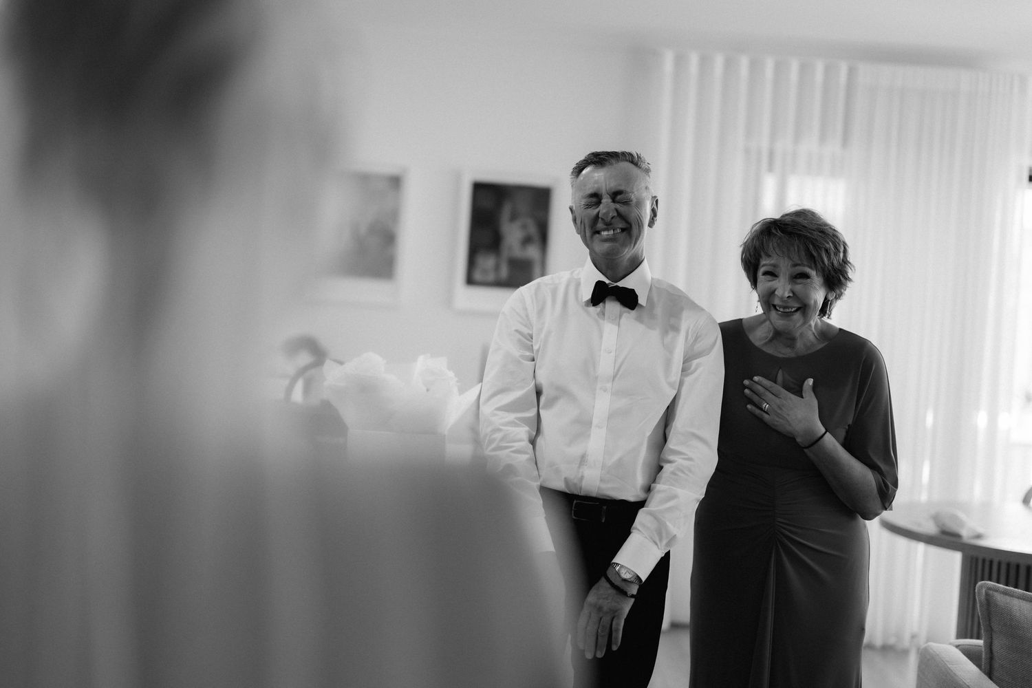 Black and white photo collage showing people in various candid poses in an office setting.