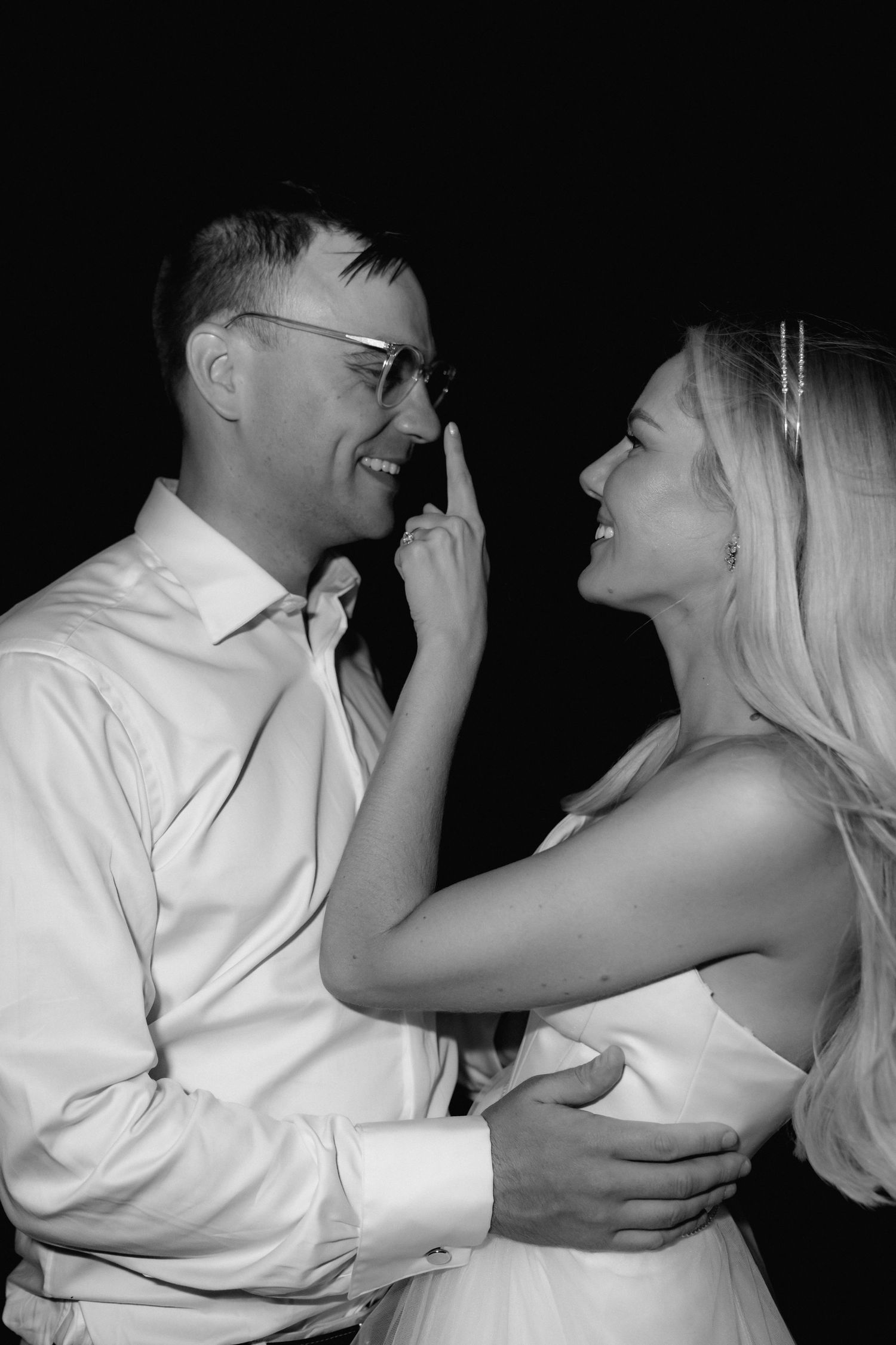 Black and white photo sequence showing a playful moment between a couple in formal attire.