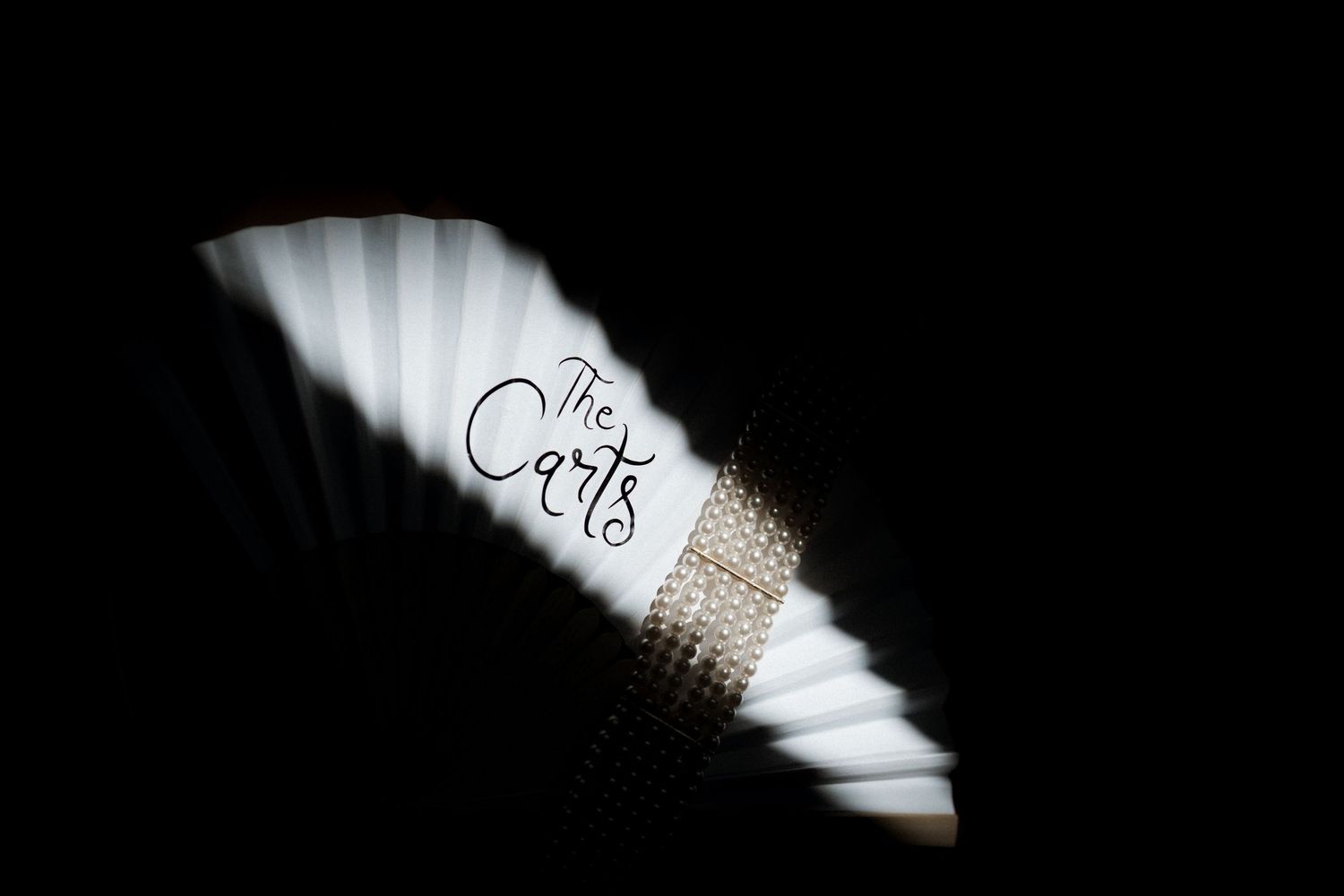 A series of black and white abstract photographs showing curved lines and shadows in a minimalist style.