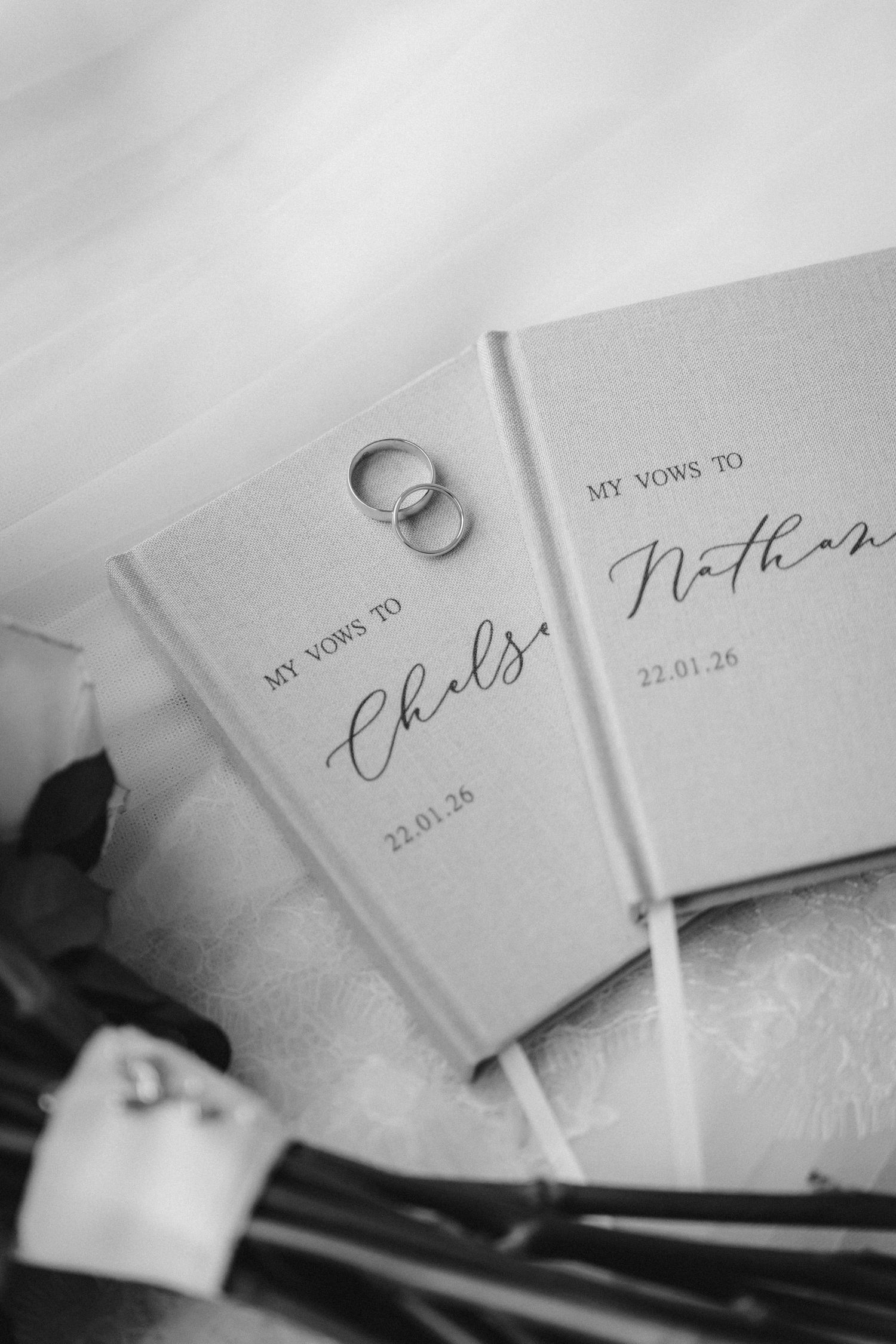 Close-up shots of handwritten wedding stationery and name cards in elegant calligraphy.