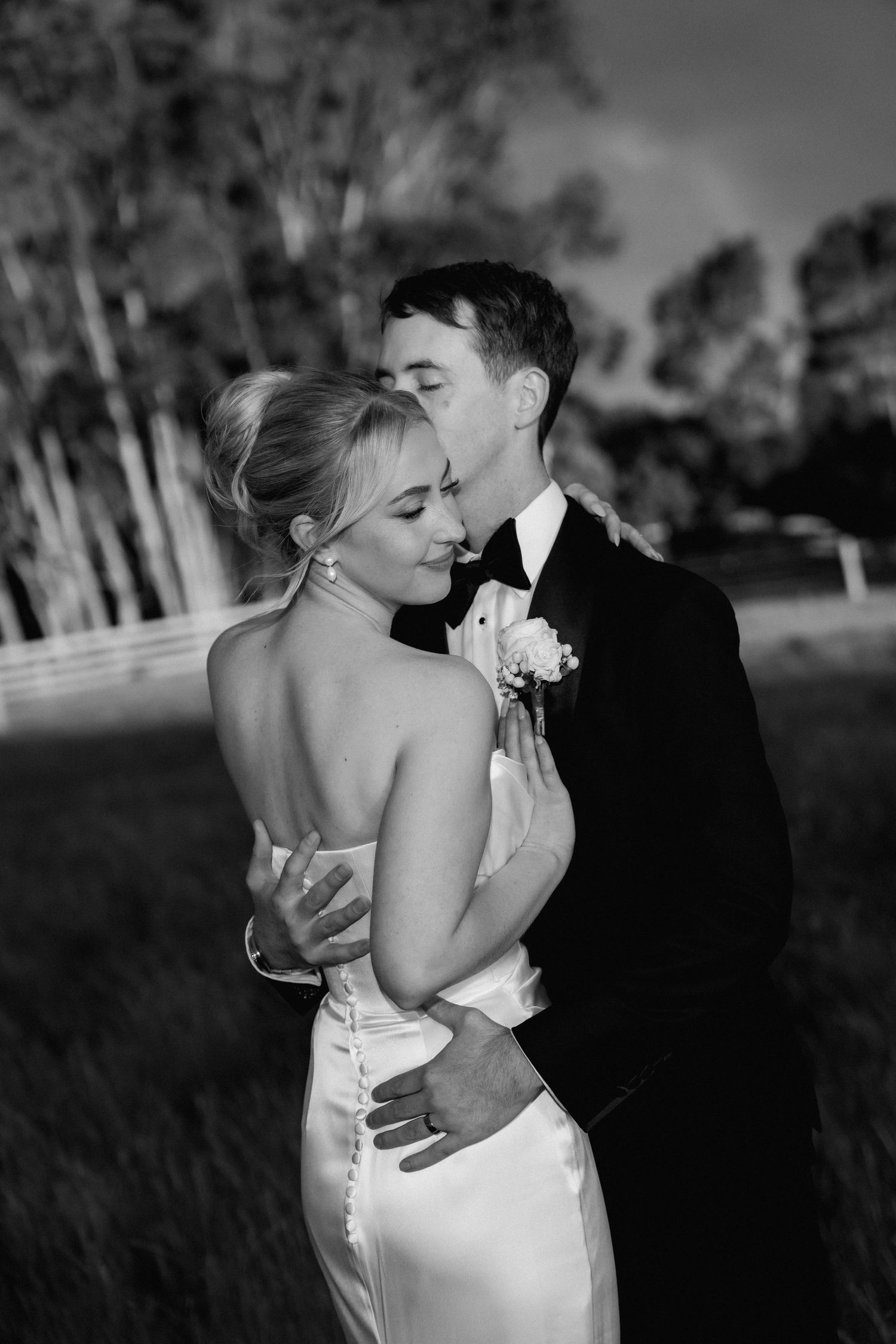 Romantic black and white wedding portraits showing intimate moments between newlyweds.