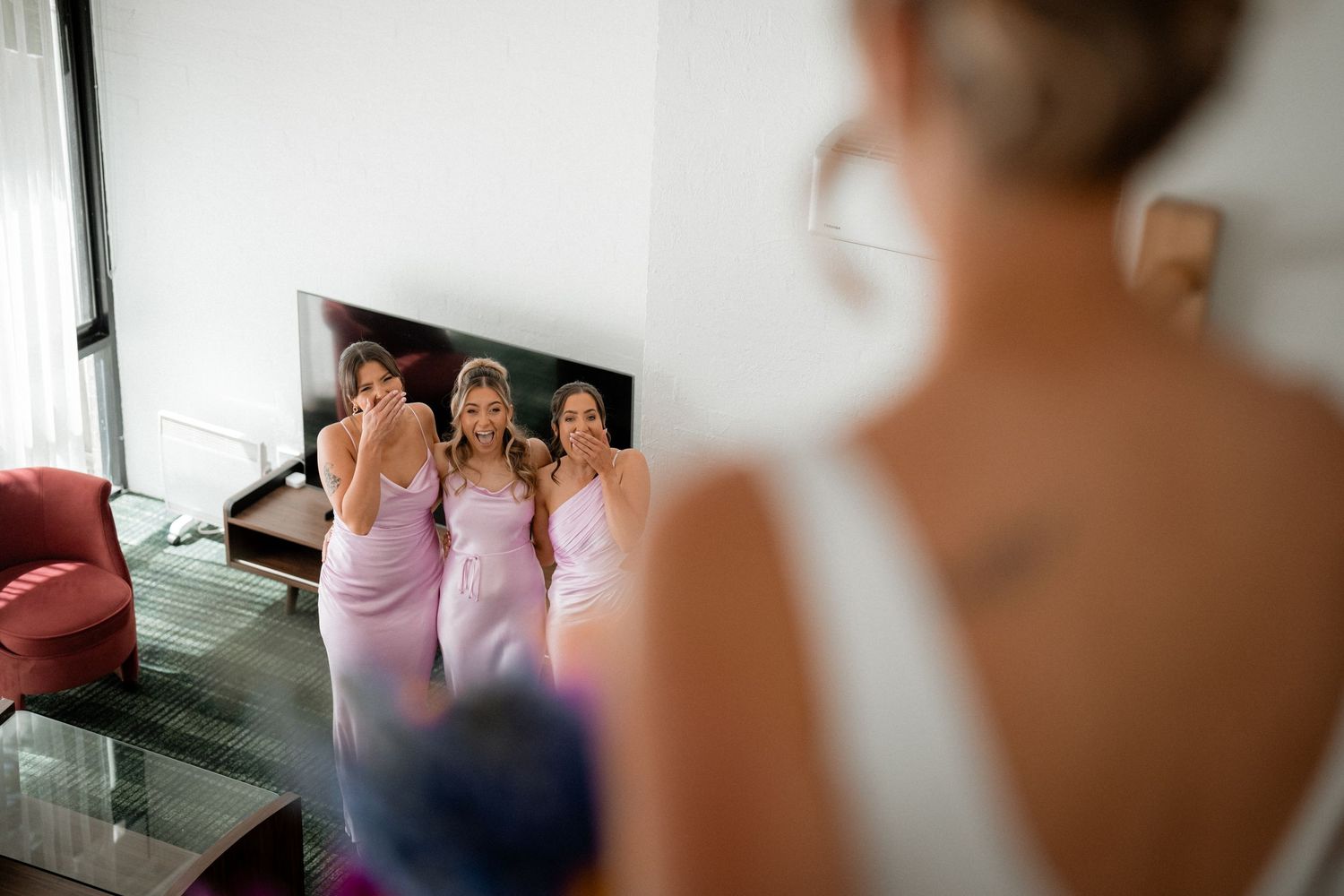 Atmospheric sequence captures bridesmaids getting ready in soft natural light.