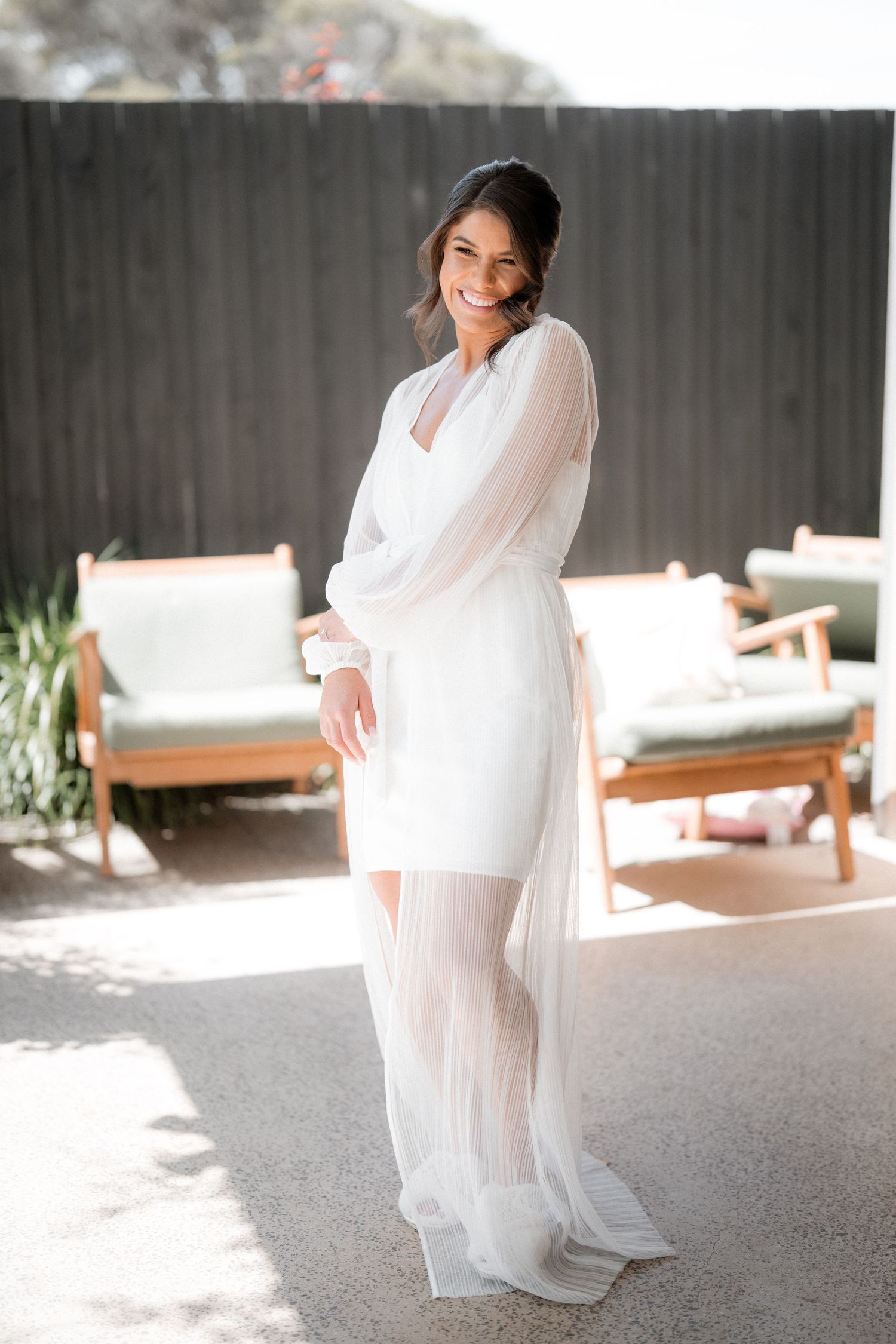 Series of elegant bridal preparation photos showing flowing white dress in natural light.