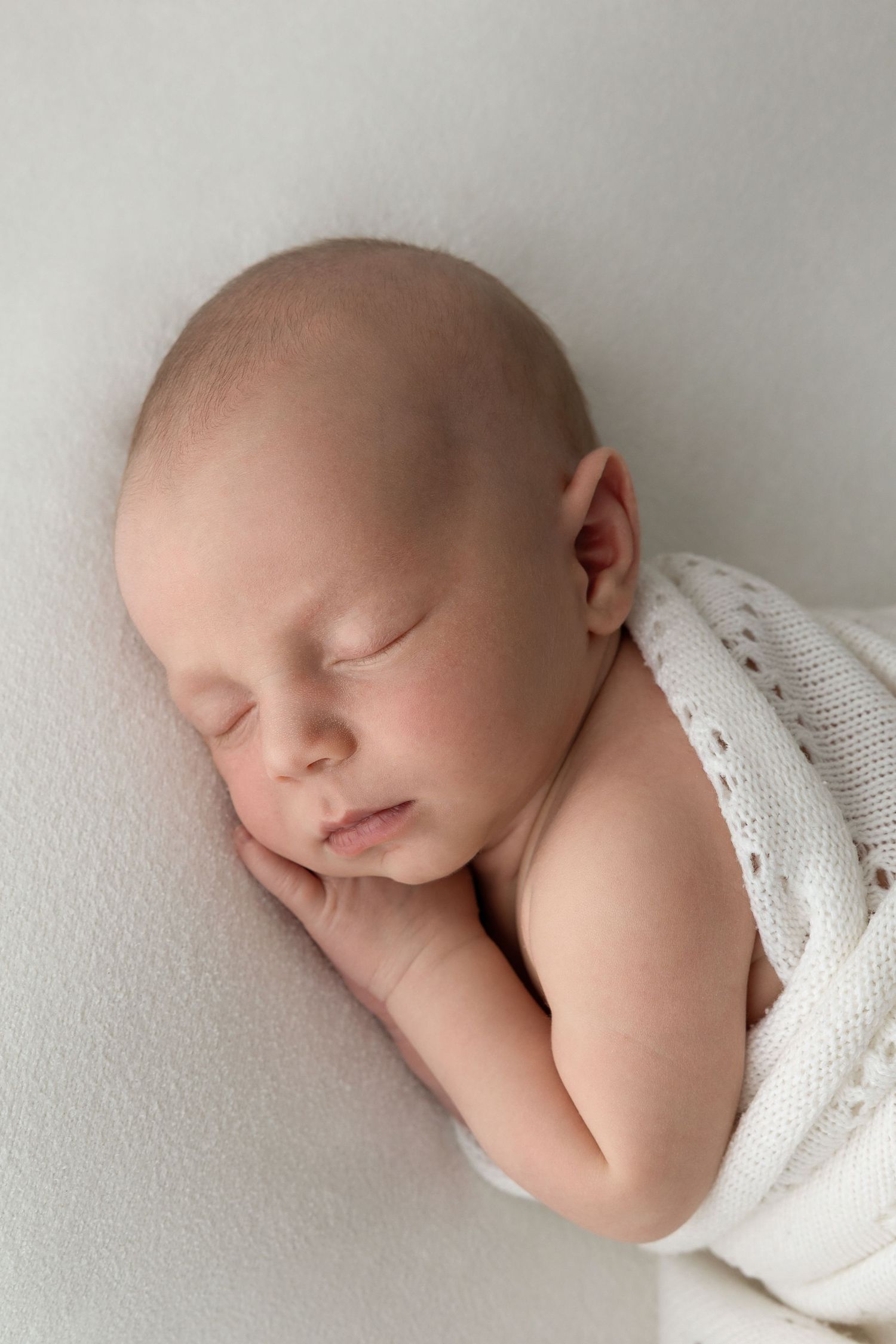 Newborn baby on a newborn baby photoshoot. Studio based in Ferndown, Bournemouth, Dorset.