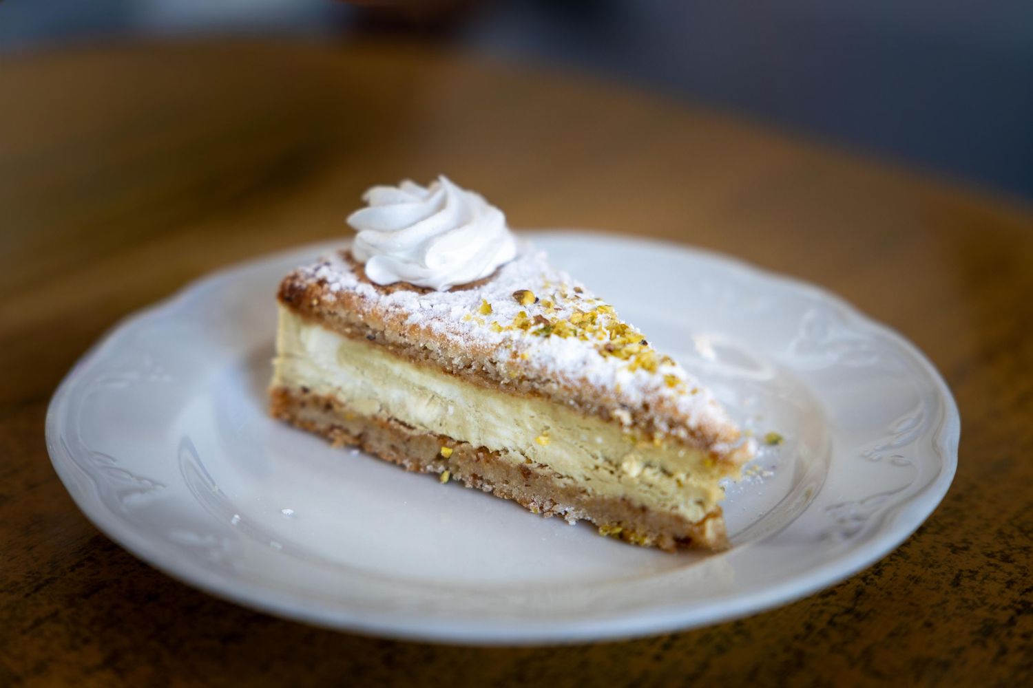 Traditional Amalfi lemon pie on a white plate, food and restaurant photography by Anthony West