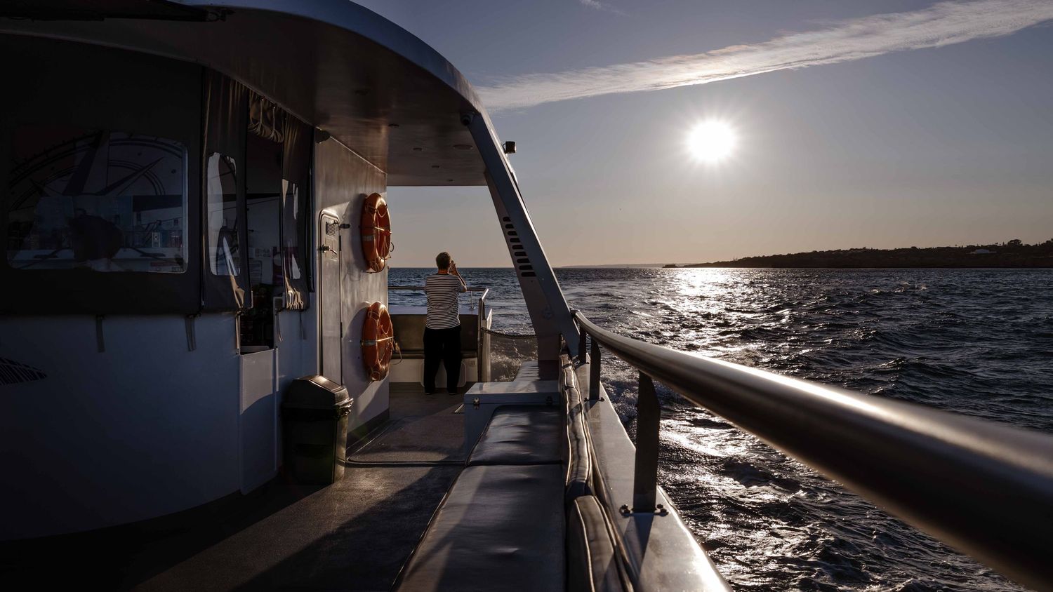 View from the deck of a boat off the Algarve coast at sunset, fine art travel photography Portugal