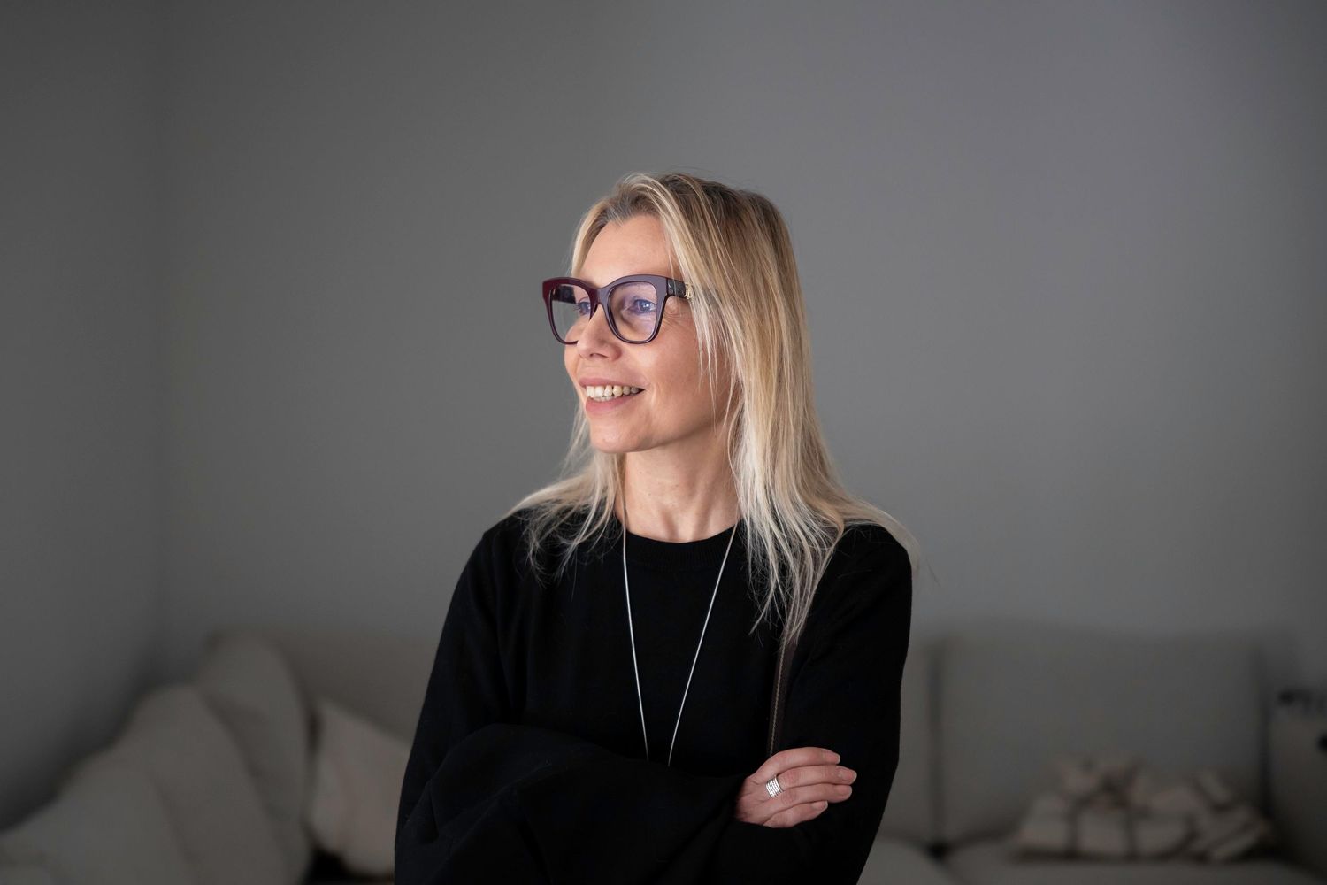 Candid personal branding portrait of a professional woman with arms folded, personal branding photography by Anthony West