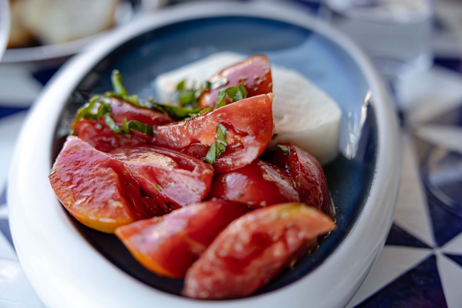 Fresh tomato and mozzarella salad served on the Amalfi Coast, Italy, food and restaurant photography by Anthony West