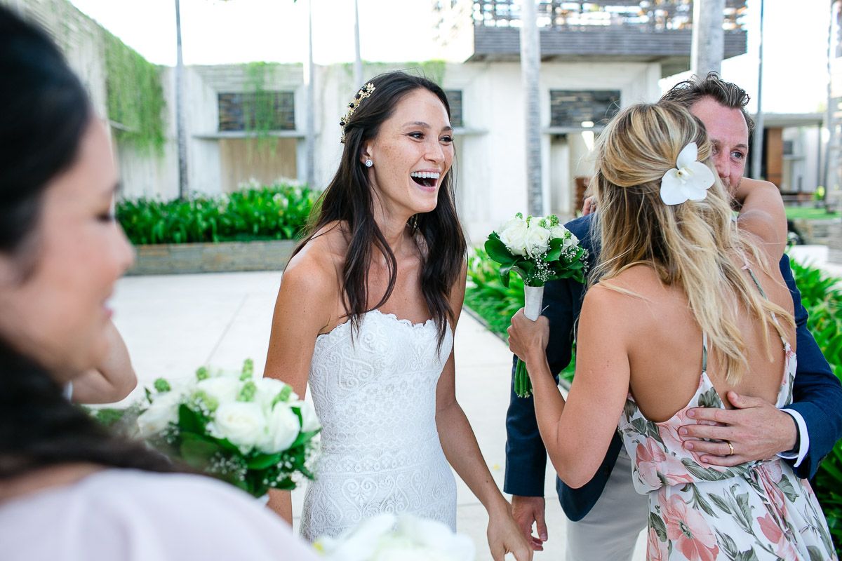 Candid celebration moment at outdoor wedding reception with guests.