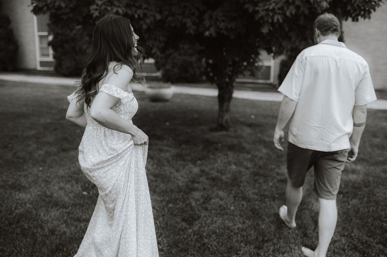 A series of black and white photos showing a couple celebrating their wedding day in an outdoor garden setting.