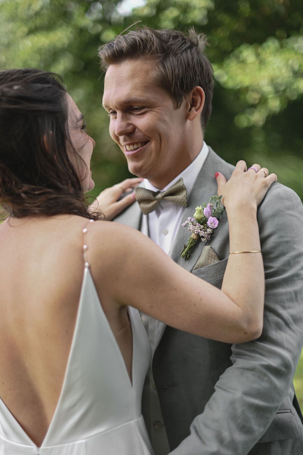 A romantic sequence of wedding photos showing a couple sharing intimate moments in an outdoor garden setting.