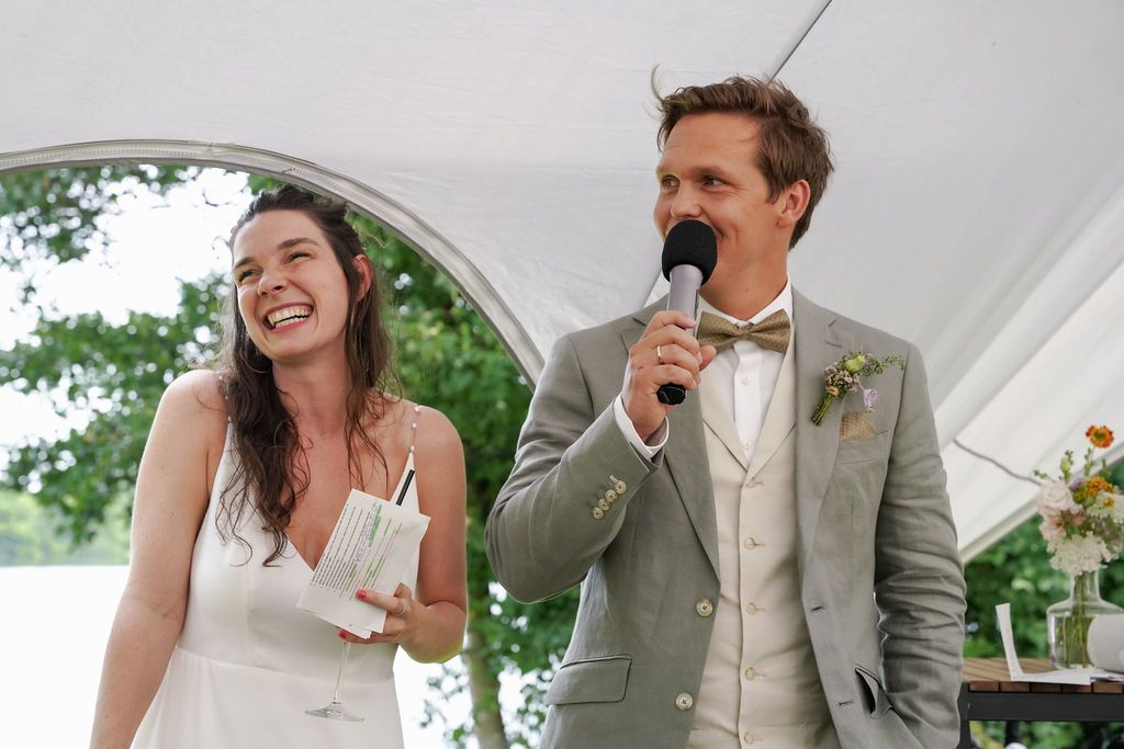 A series of candid wedding reception moments showing joyful interactions between guests under a white tent.
