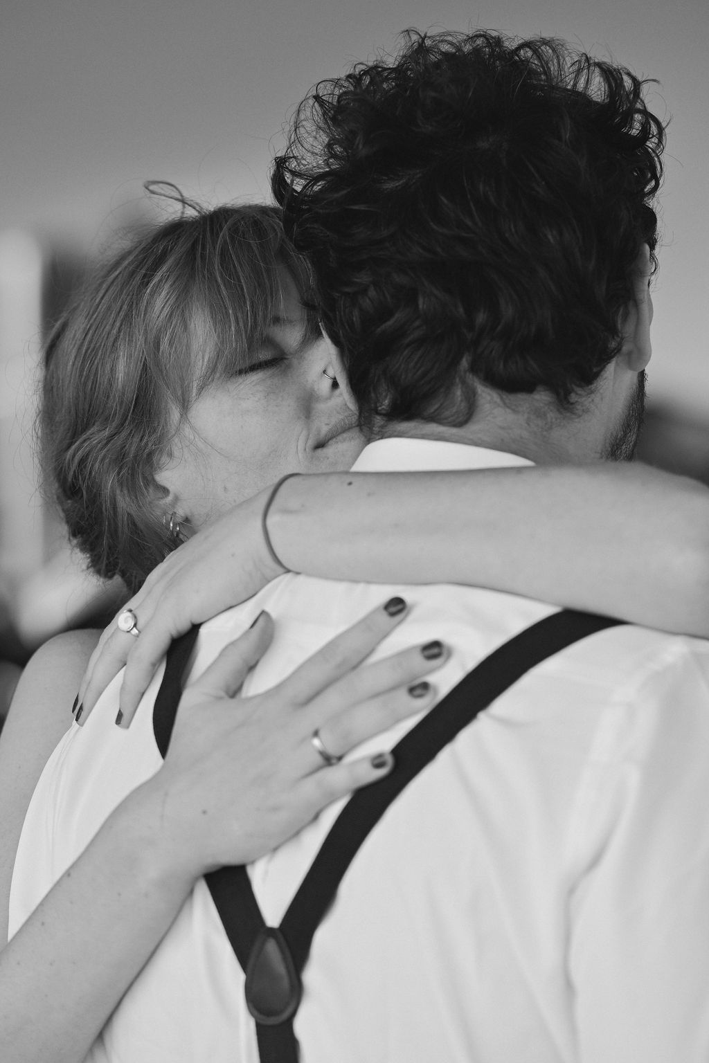 Black and white series of intimate embraces showing tender romantic moments between two people.