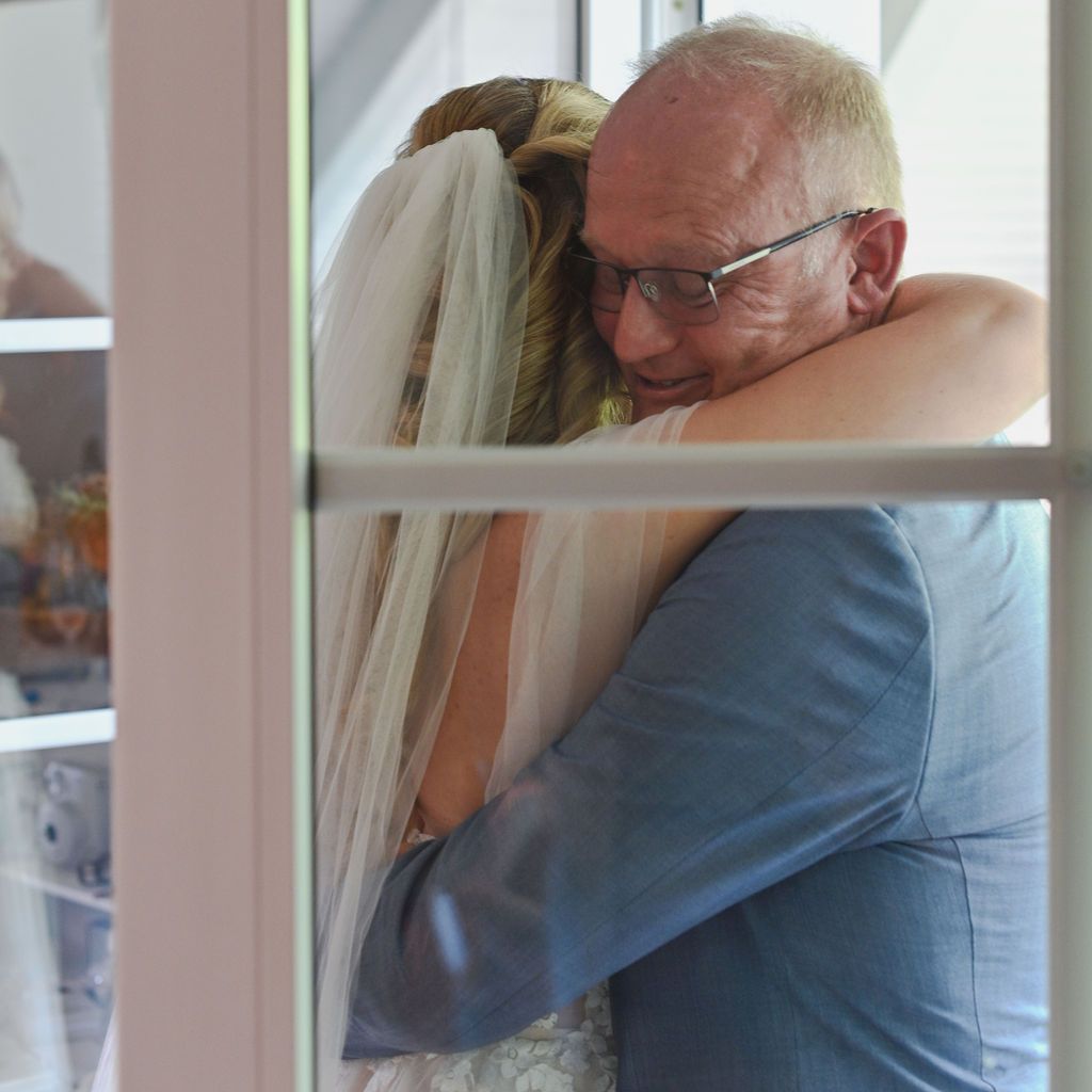 Series of emotional moments showing a first look between a couple in formal attire by a window.