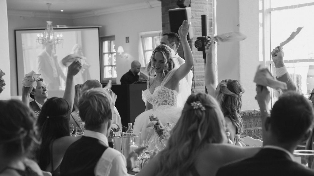 A large crowd of people gathered in an indoor venue for what appears to be a social event or celebration.