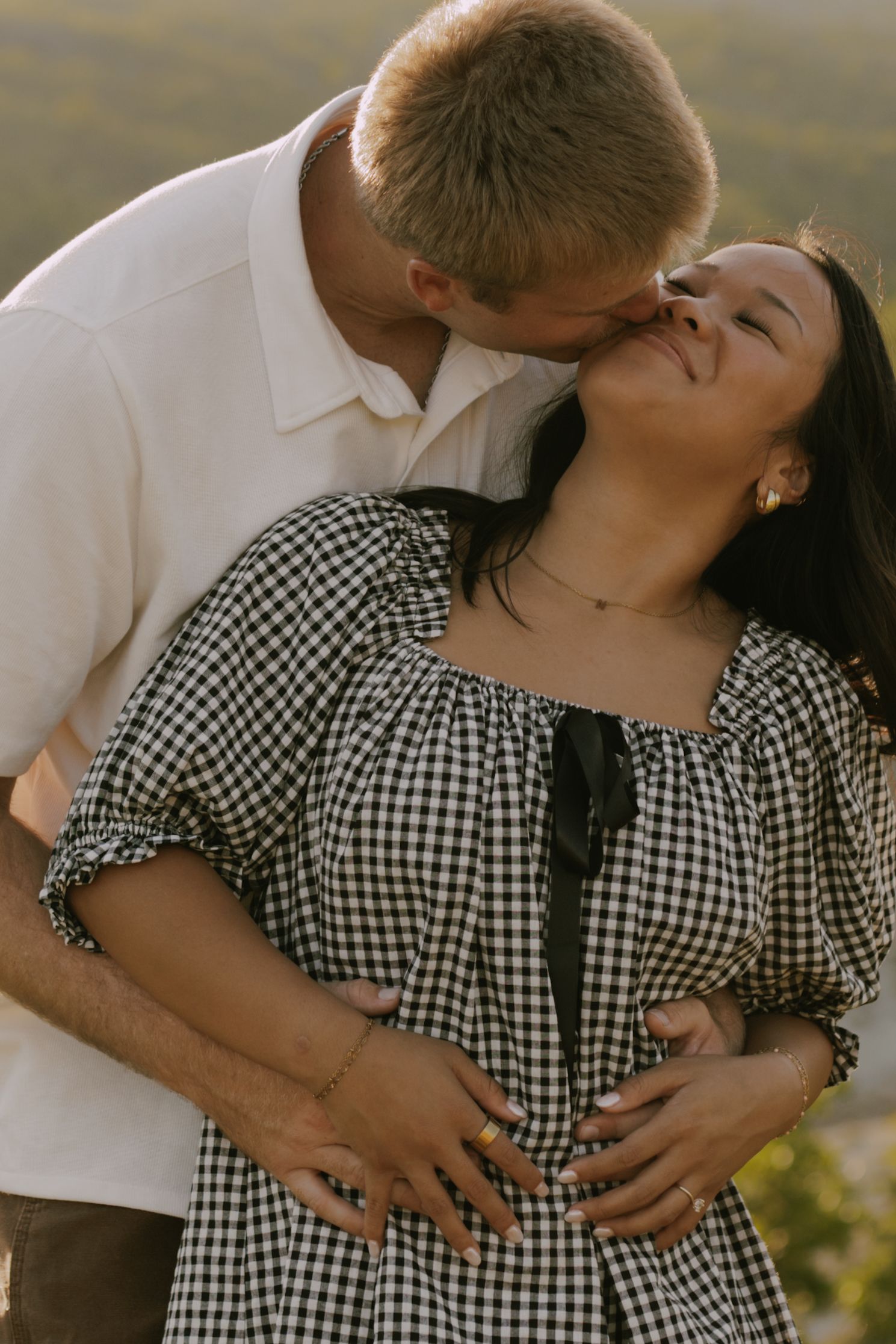 An intimate sequence of moments captured in warm sunlight against a natural landscape.