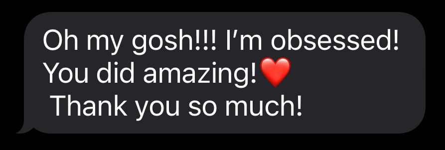 Mobile message showing excitement with heart emoji on black background.