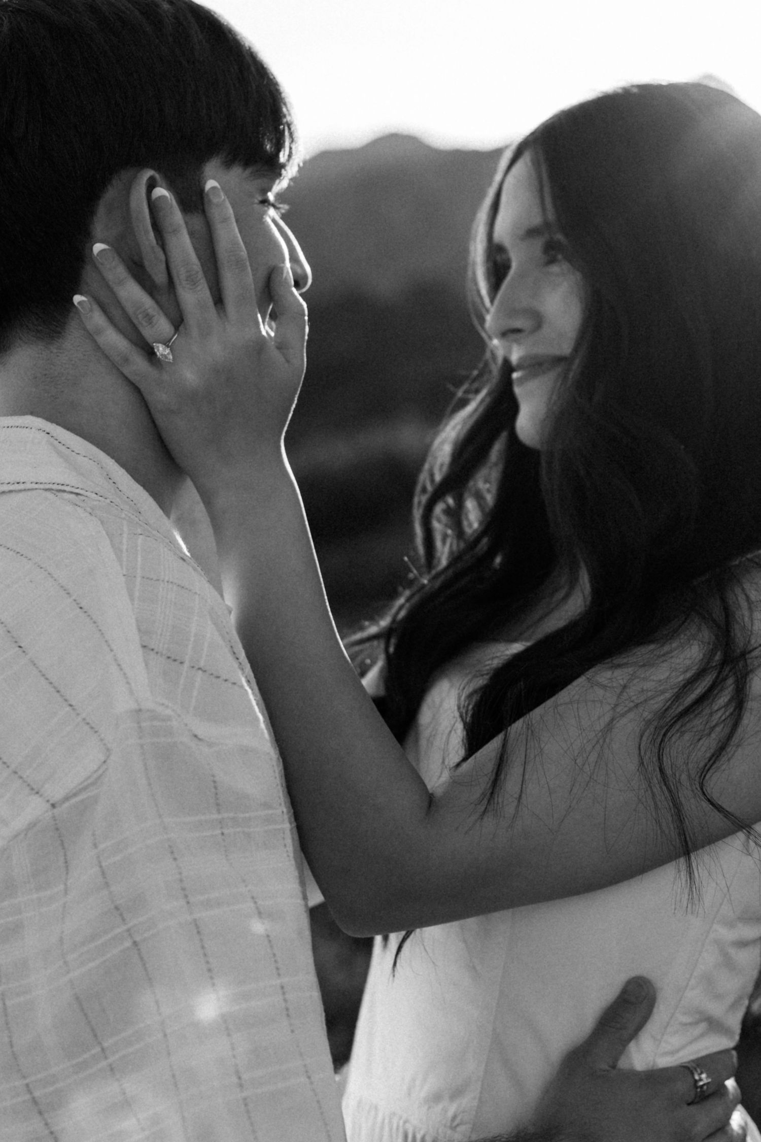 Intimate black and white portrait captured in natural sunlight.