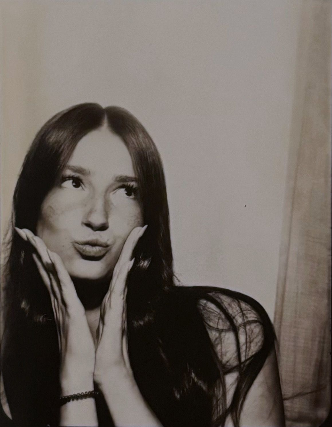 Series of black and white photos showing hands covering face.