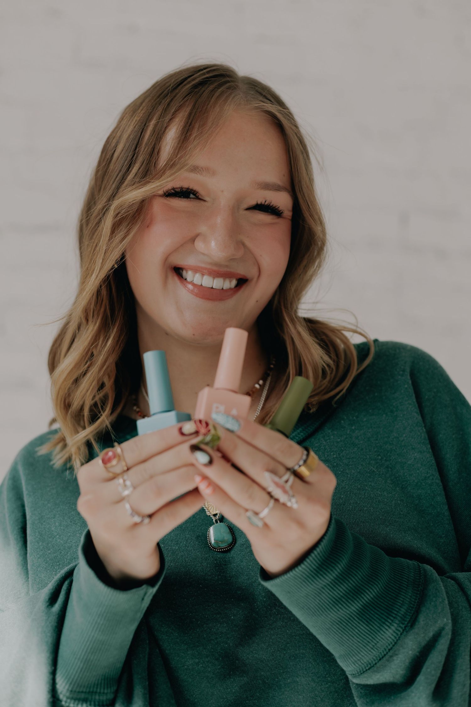 Close-up shots showing joyful expressions while holding small bottles.