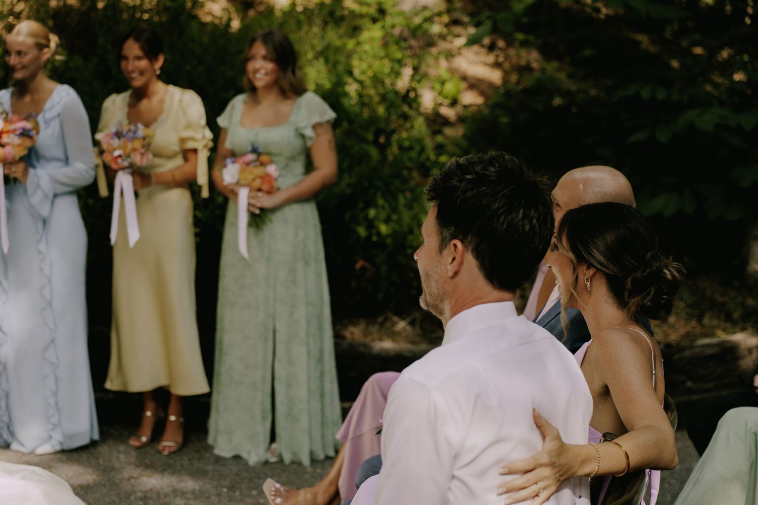 Wedding celebration candid moments captured during an outdoor reception.