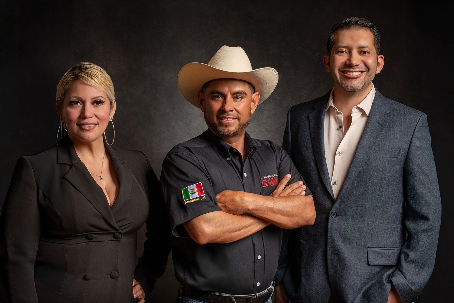Professional group photo of three people in business attire with one wearing a cowboy hat taken in West Los Angeles.