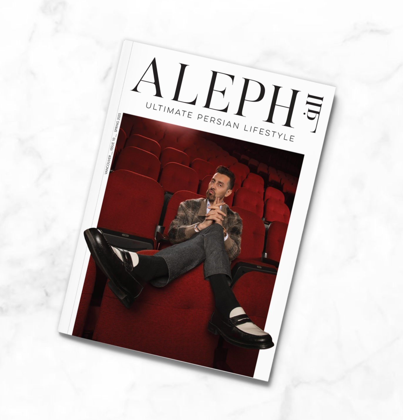 persian comedian Max Amini on Magazine cover and layout for Aleph publication with red theater seats in Kia Forum