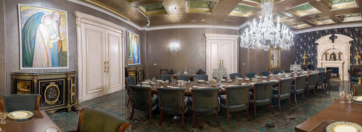 A 360-degree panoramic view of an elegant restaurant interior with crystal chandeliers and ornate decor.