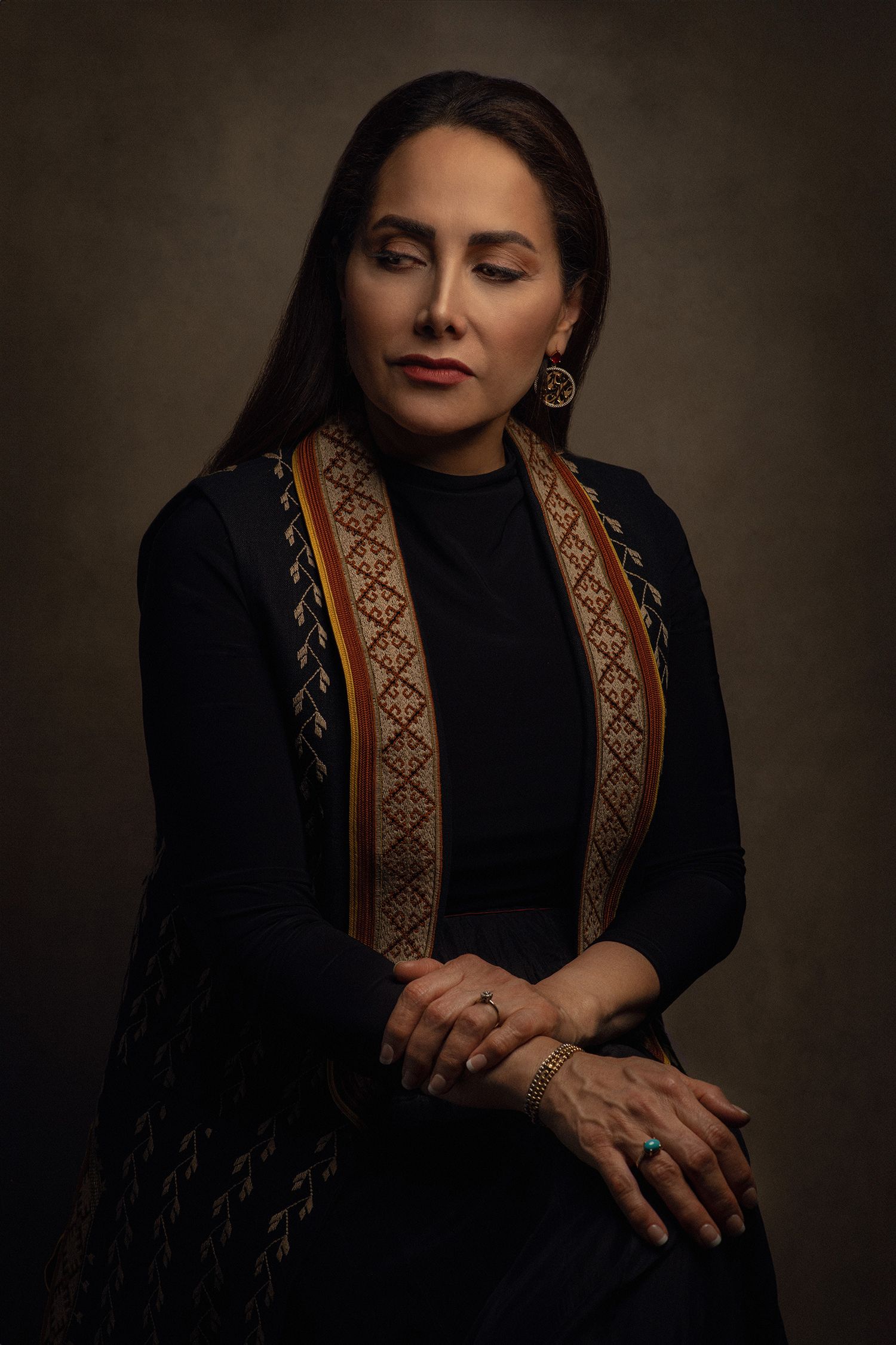 Dramatic portrait series featuring Iranian singer Mojgan Shajarian in black outfit with ornate ethnic trim detail taken in Westwood.