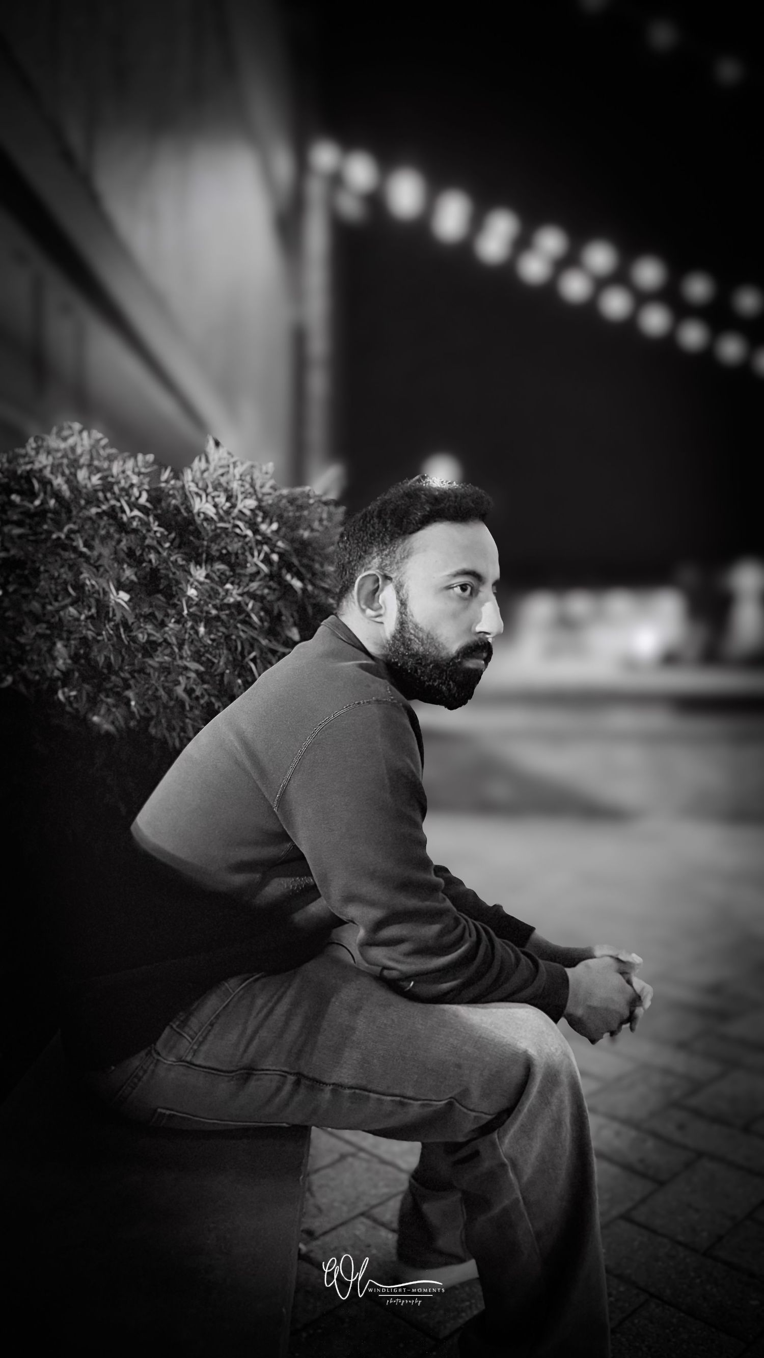 A black and white portrait series shows a person in a dark jacket sitting and turning to look over their shoulder.