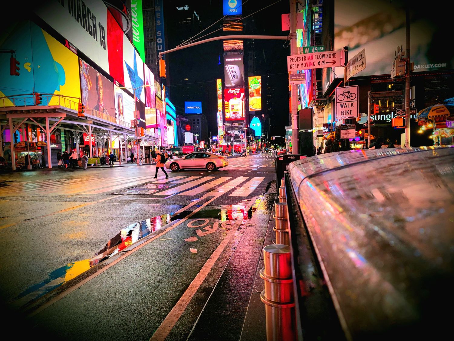 Colorful neon city street at night with glowing signs and urban atmosphere.