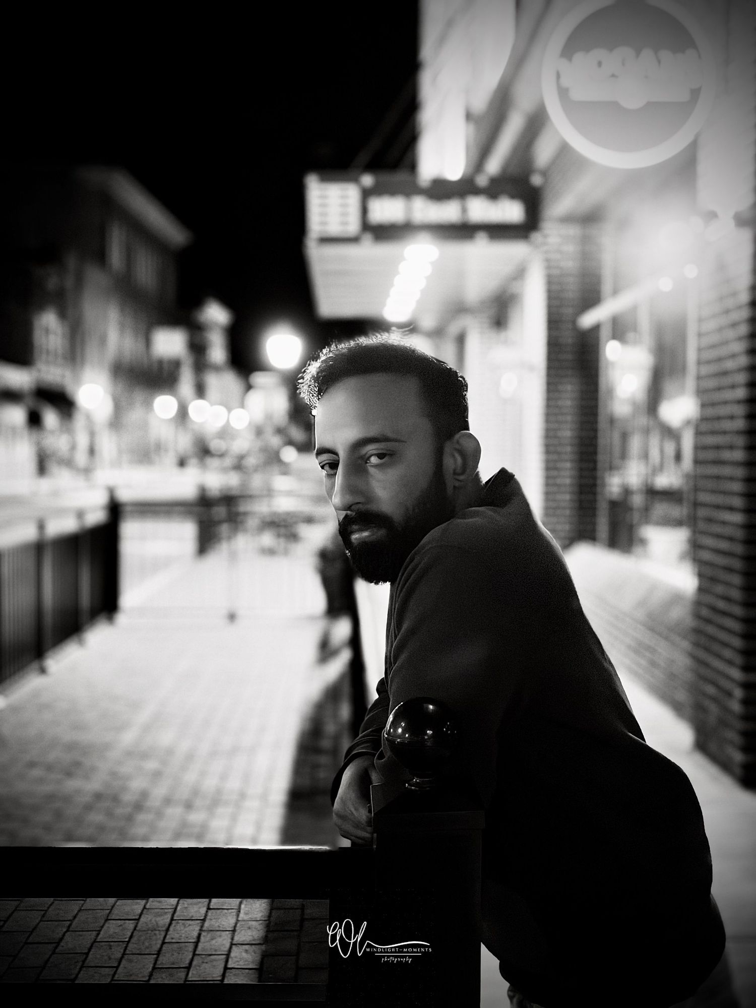 A series of black and white street photography portraits showing a person in an urban setting at night.