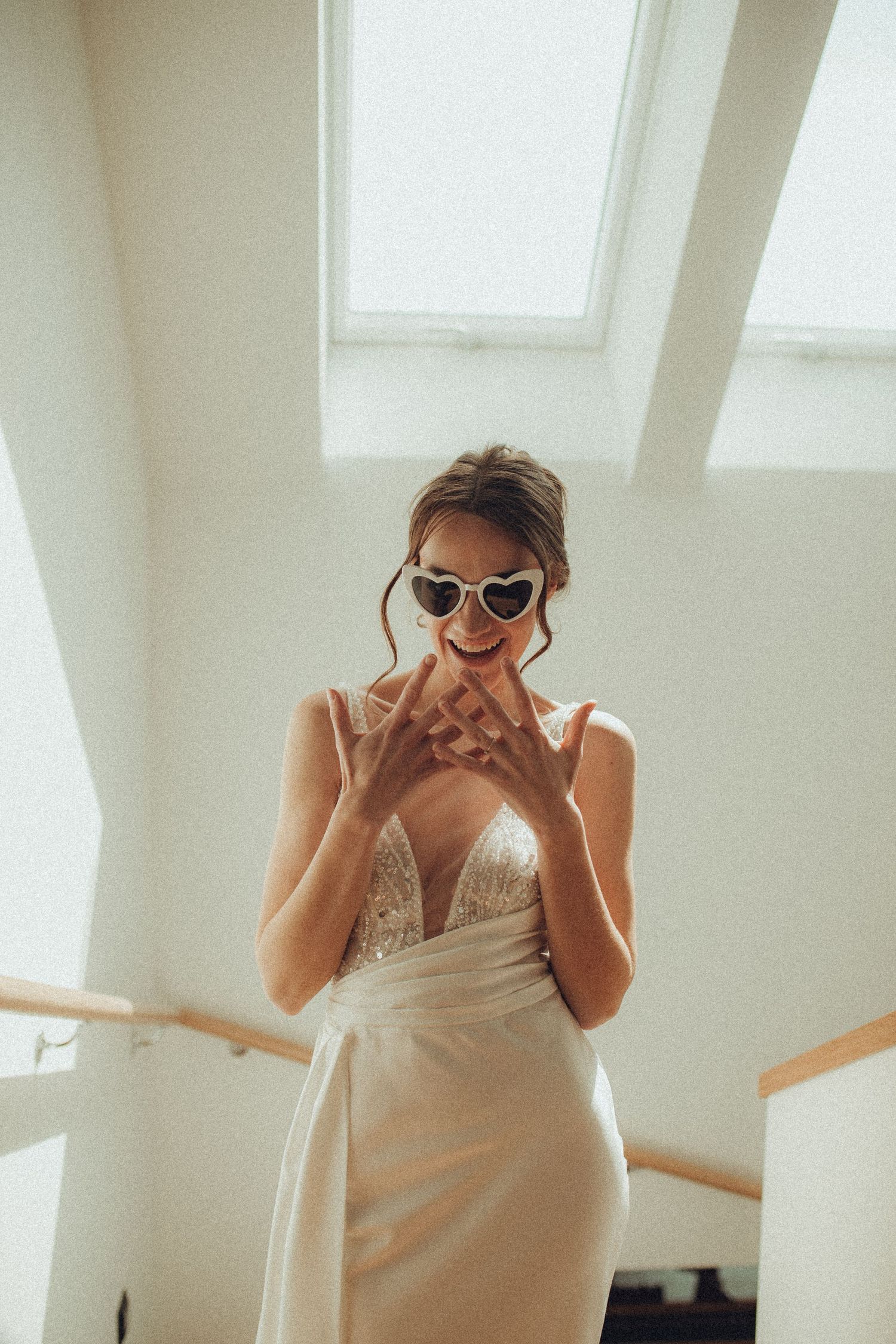 Playful sequence showing a person in a wedding dress making funny faces.