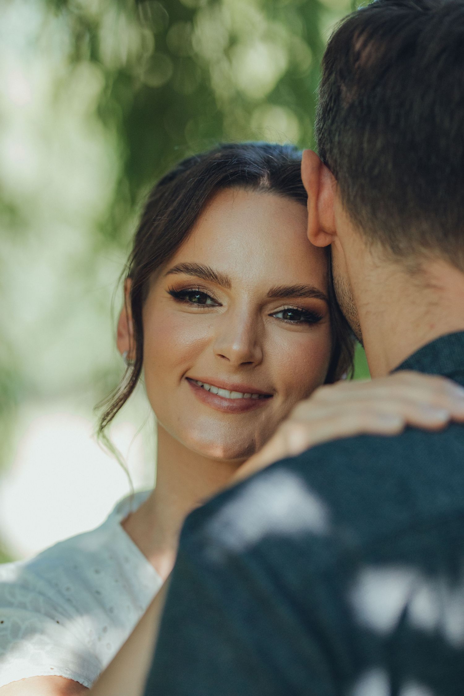A romantic outdoor portrait showing genuine happiness and connection.