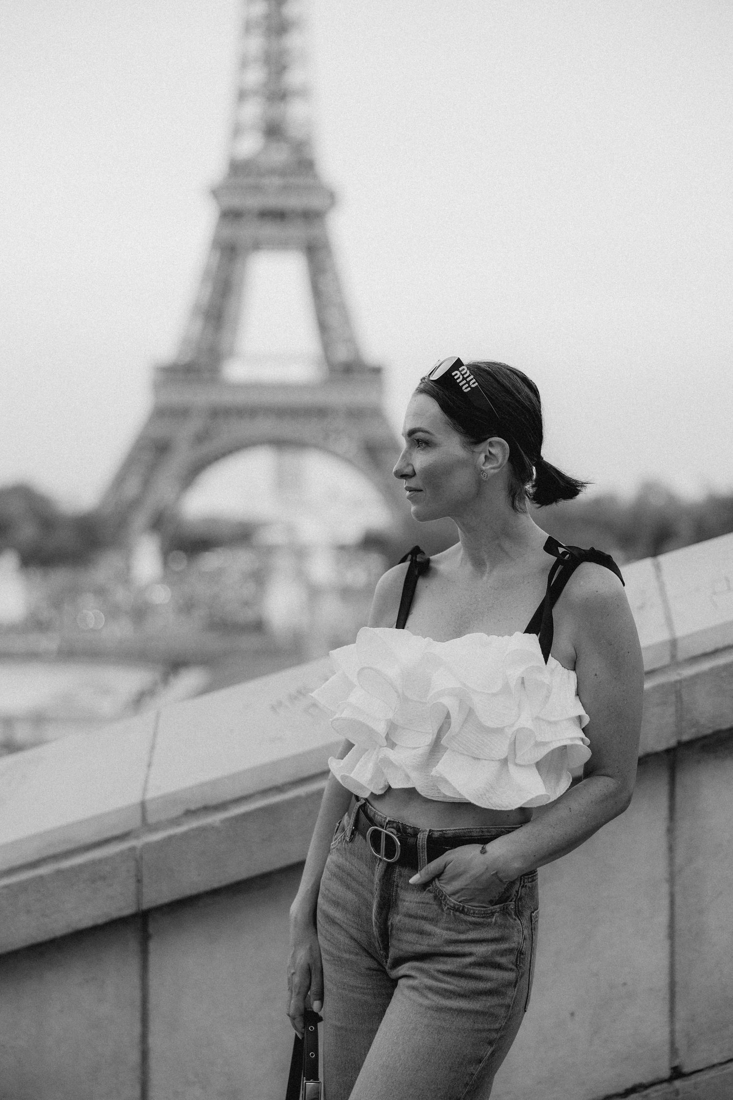 Joyful moments captured at Trocadero with Eiffel Tower backdrop in black and white.