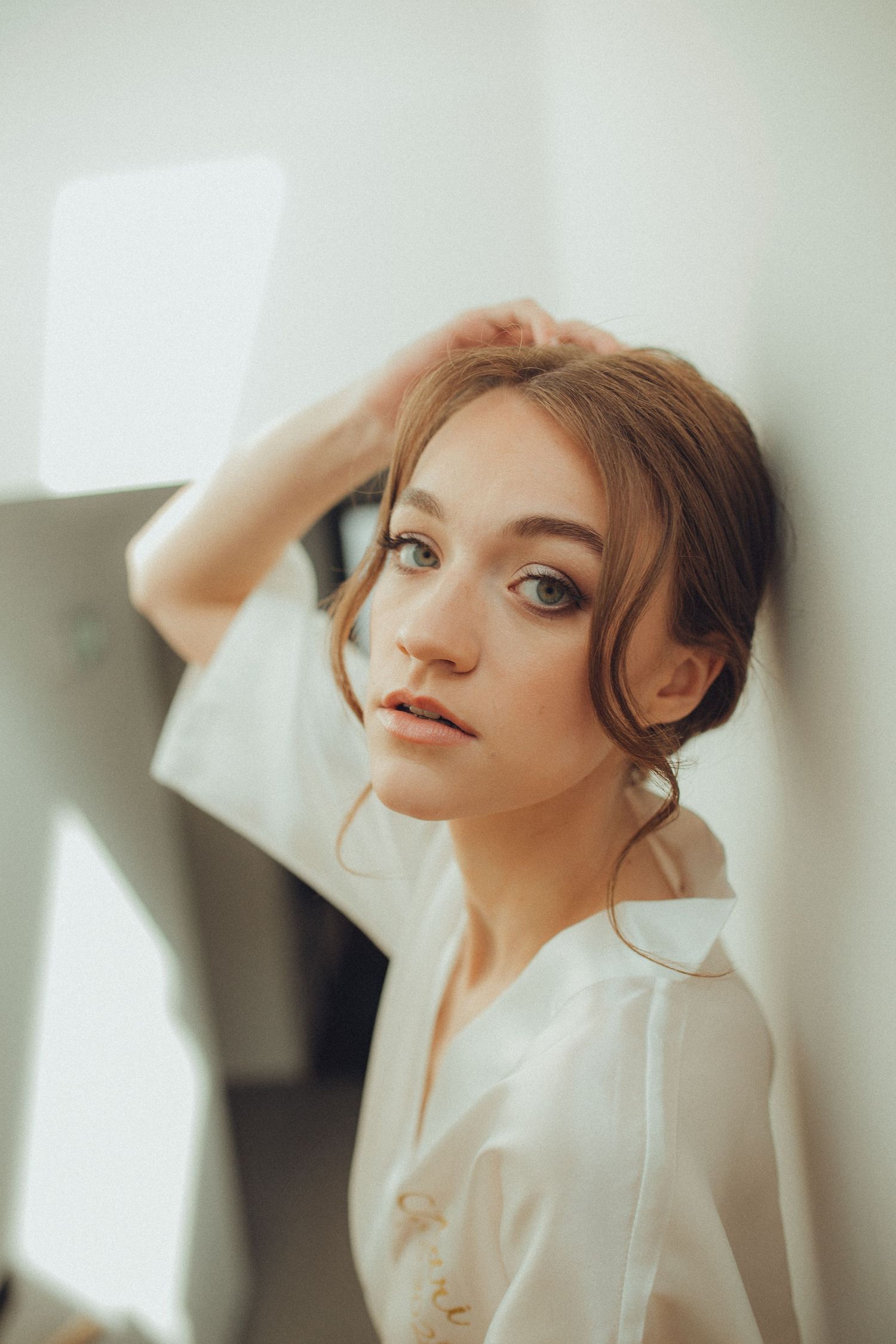 Artistic portrait shots showing a sparkling white sequined dress in soft lighting.