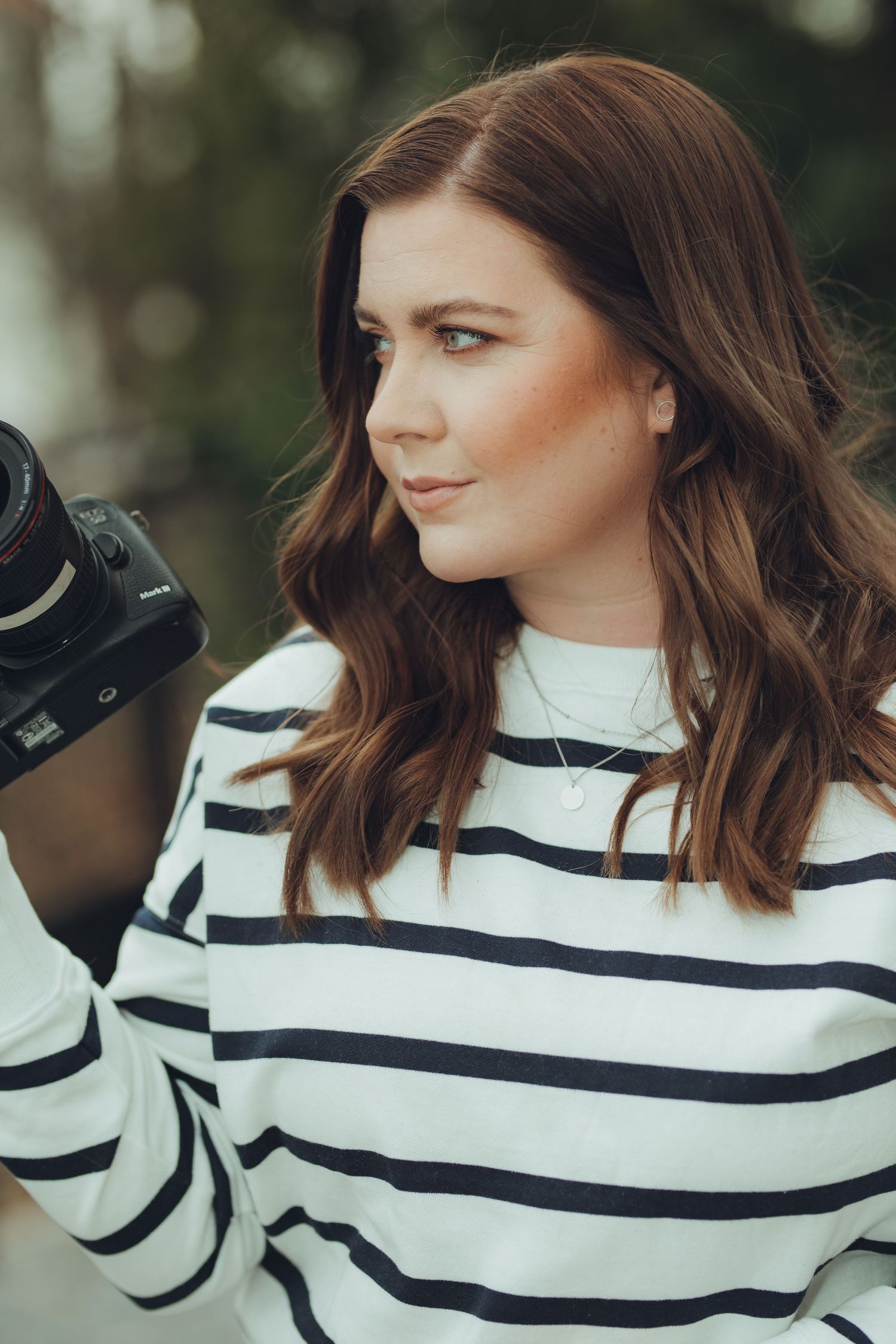 Close-up portrait series in striped sweater with white collar.