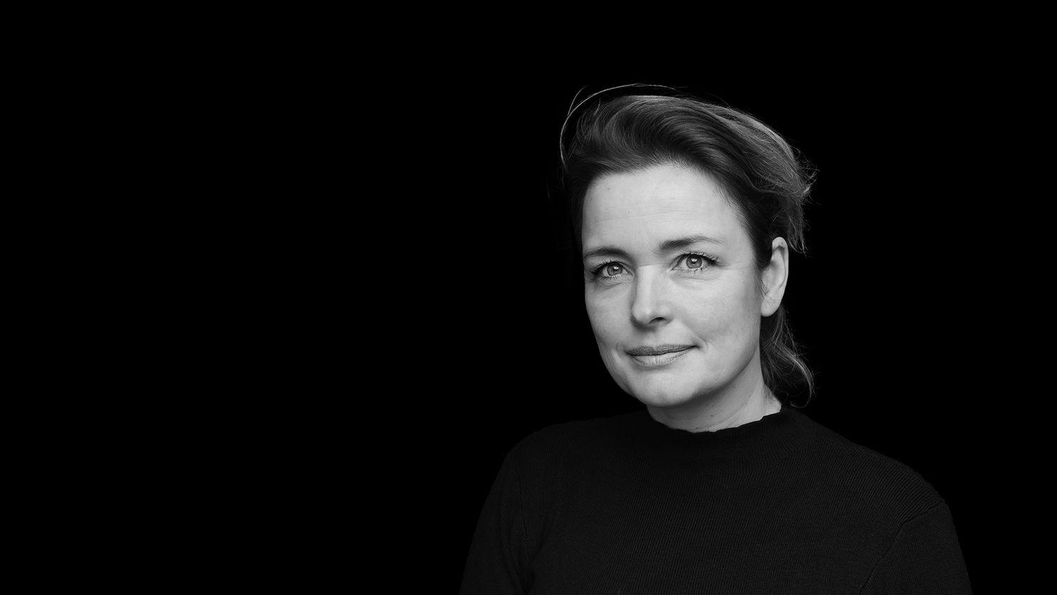 A series of black and white portrait photographs showing different expressions against a dark background.