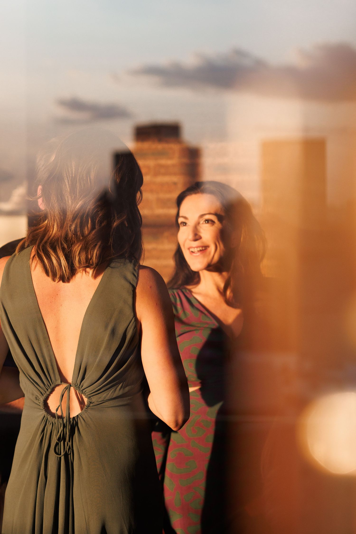 A series of photos showing someone in a dark green dress against a warm-toned background at sunset.