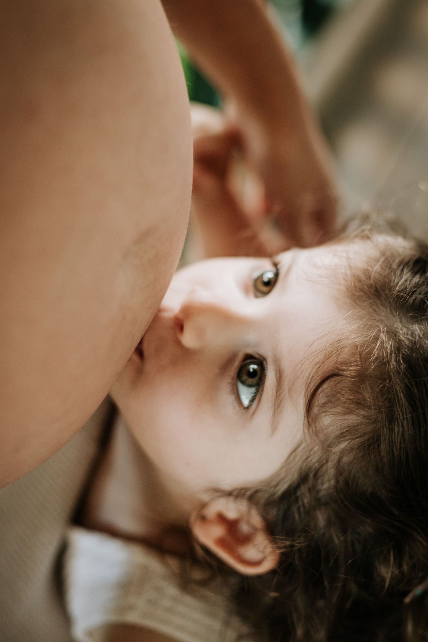 Close-up portrait with gentle expression and warm lighting creates an intimate emotional mood.