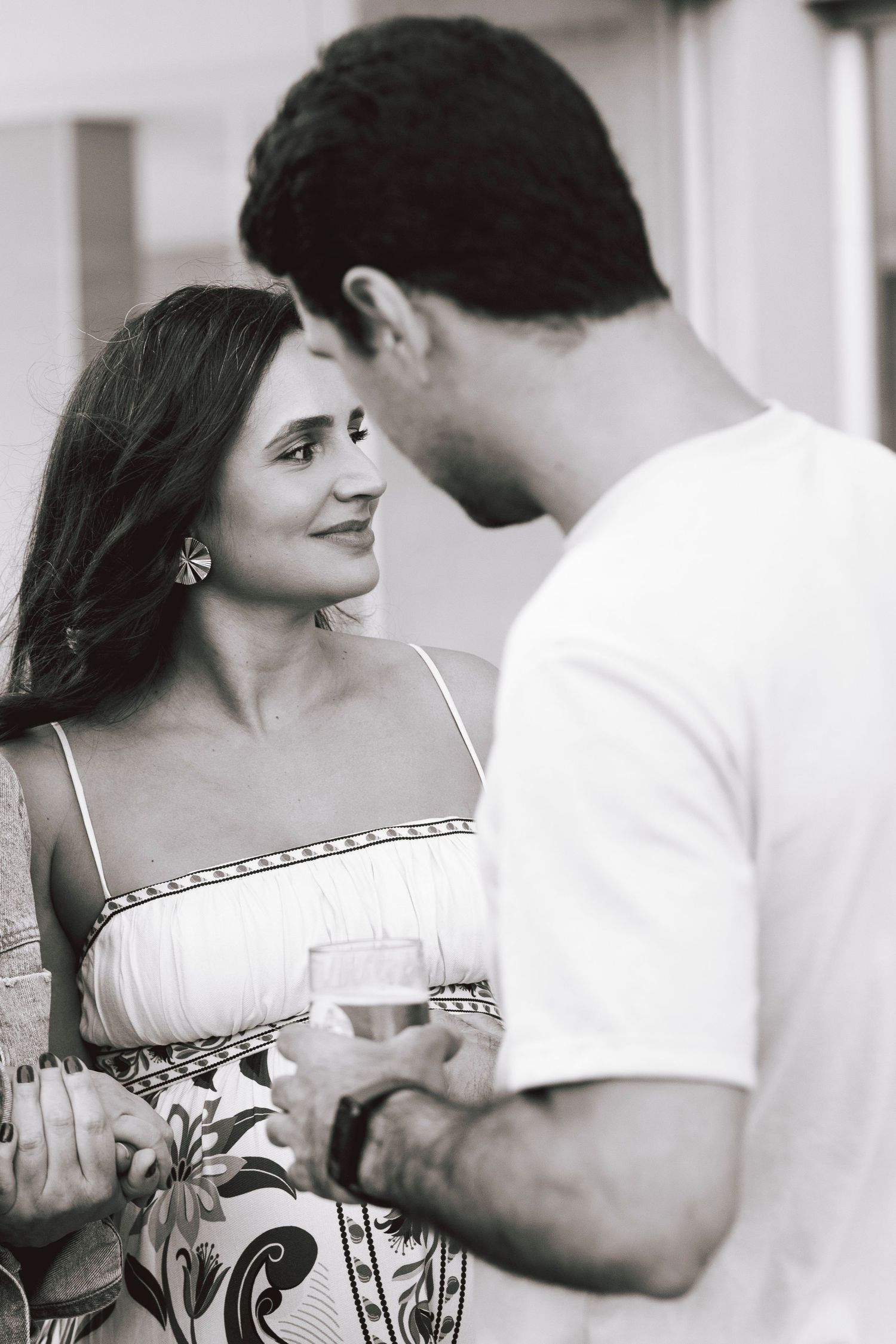 A romantic black and white photo series showing tender moments between a couple in intimate poses.