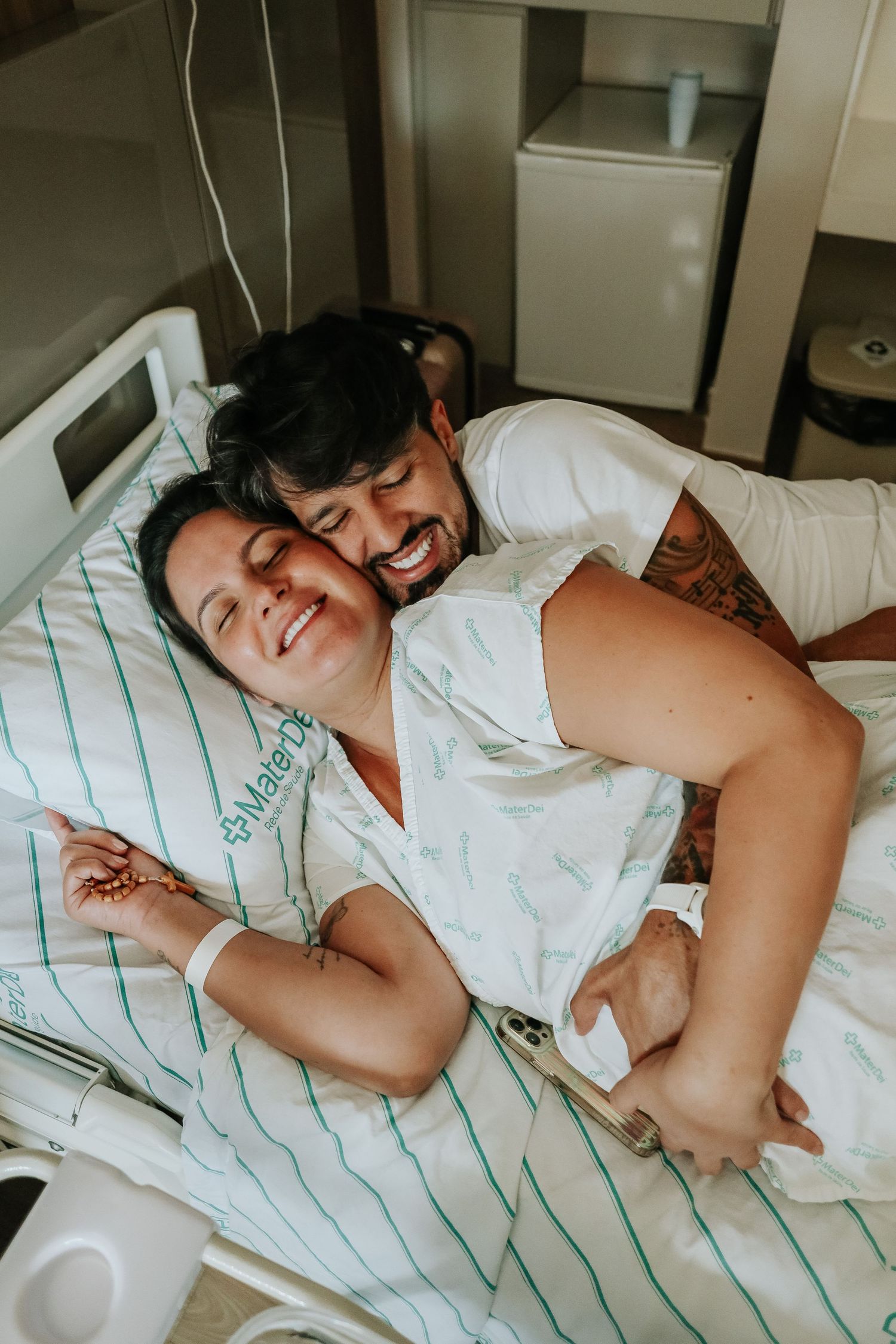 Intimate hospital room scene showing emotional connection and joy.