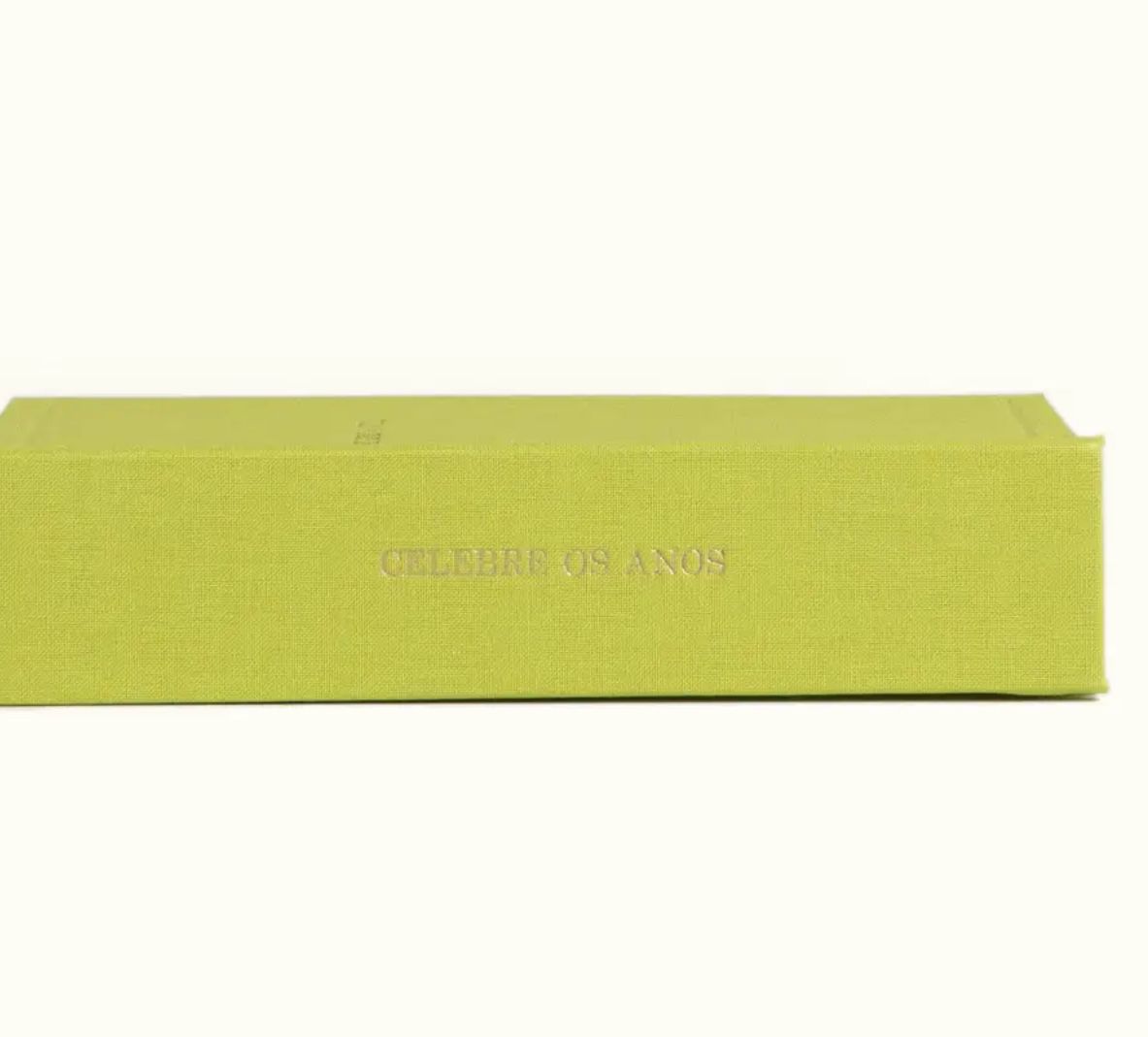 Lime green hardcover book box titled Celebre Os Anos displayed against a white background.