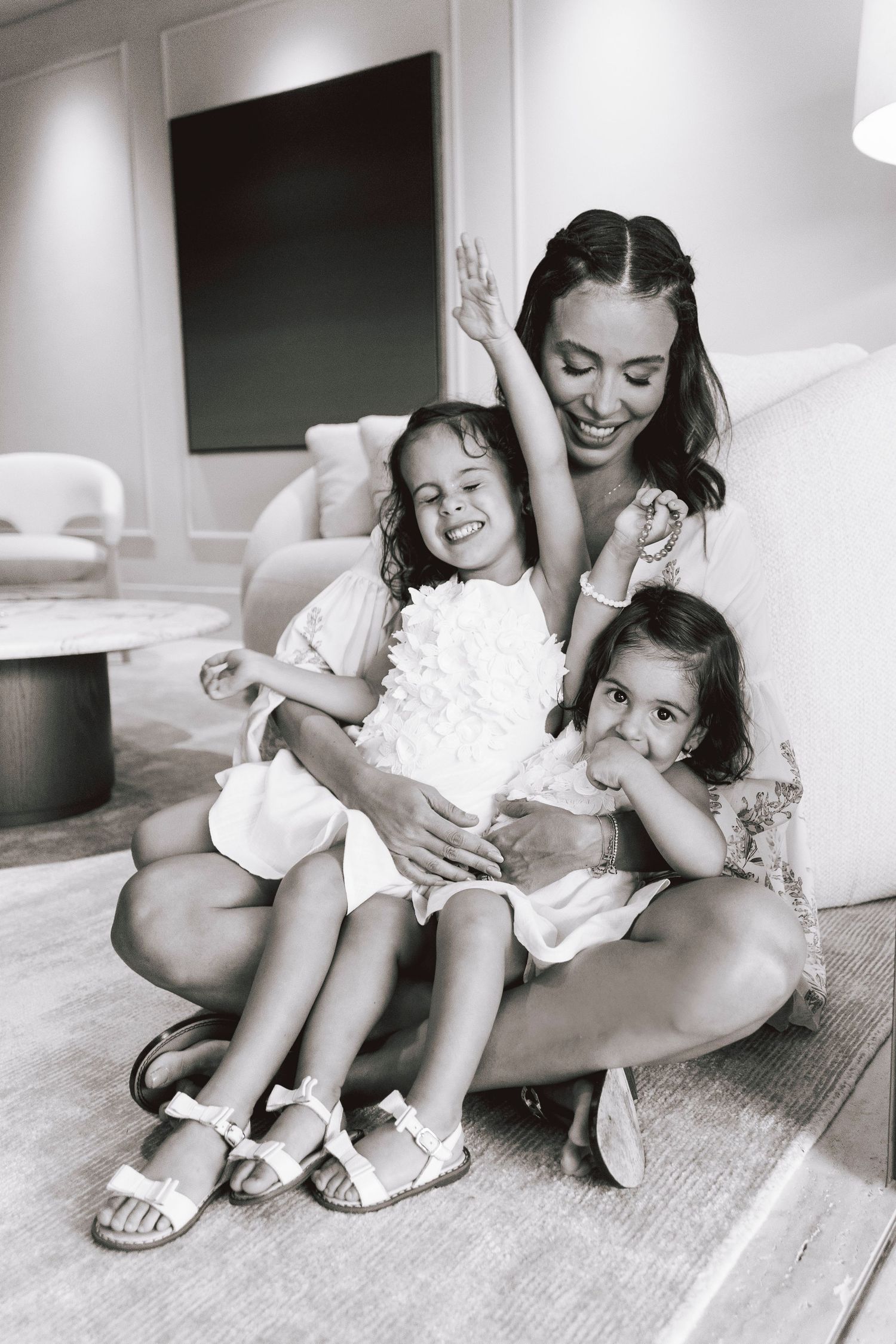 A joyful moment of play and laughter in a modern living space.
