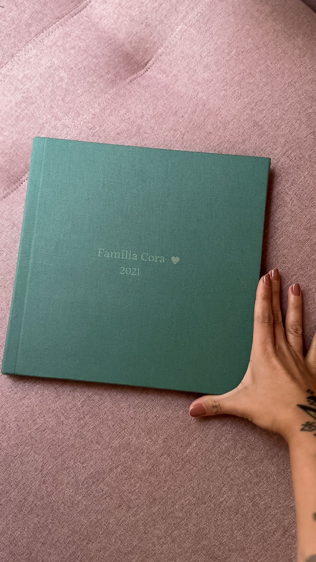 Green hardcover family photo album embossed with 